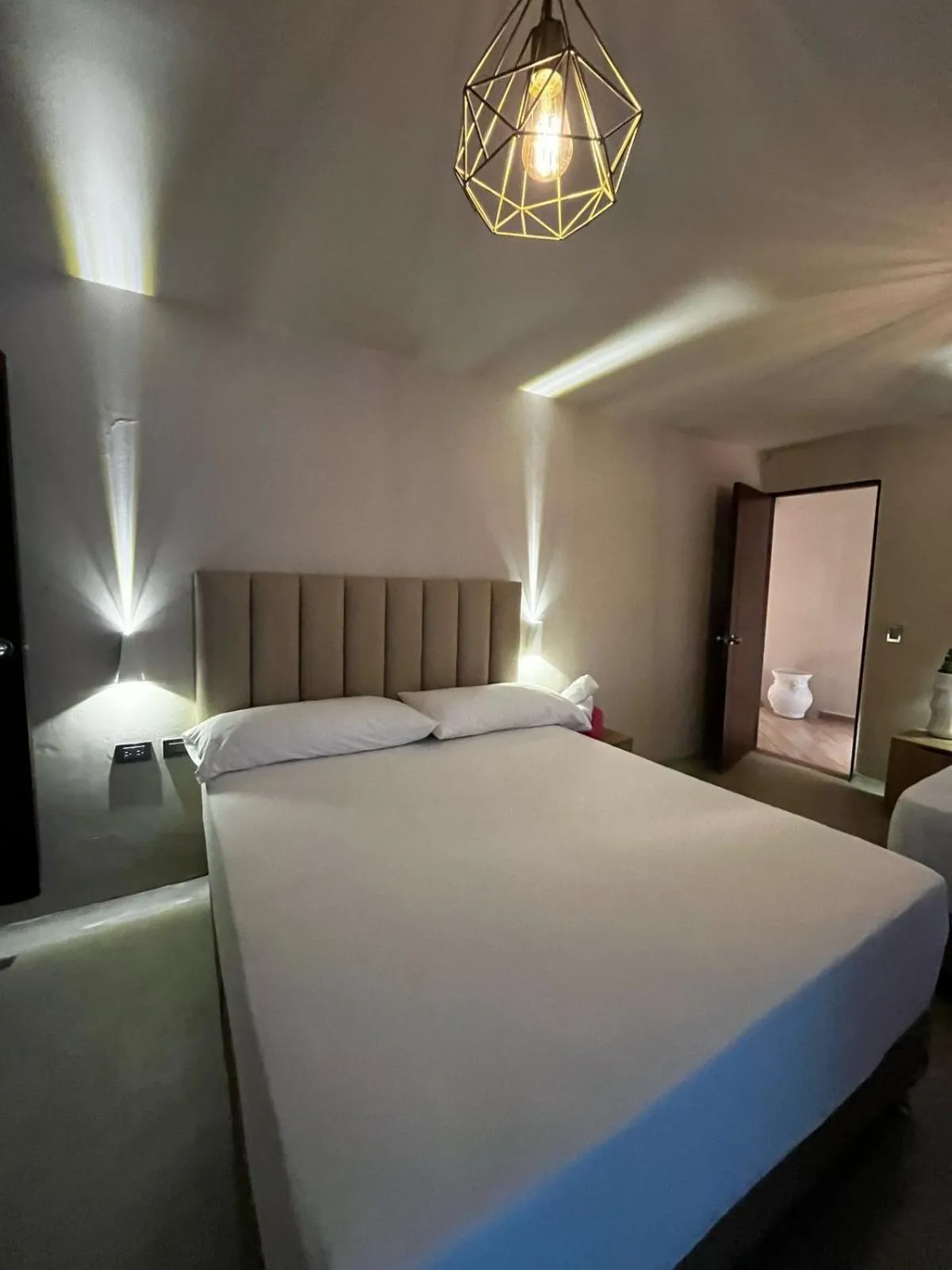 Bed in HOTEL BALI AT POBLADO