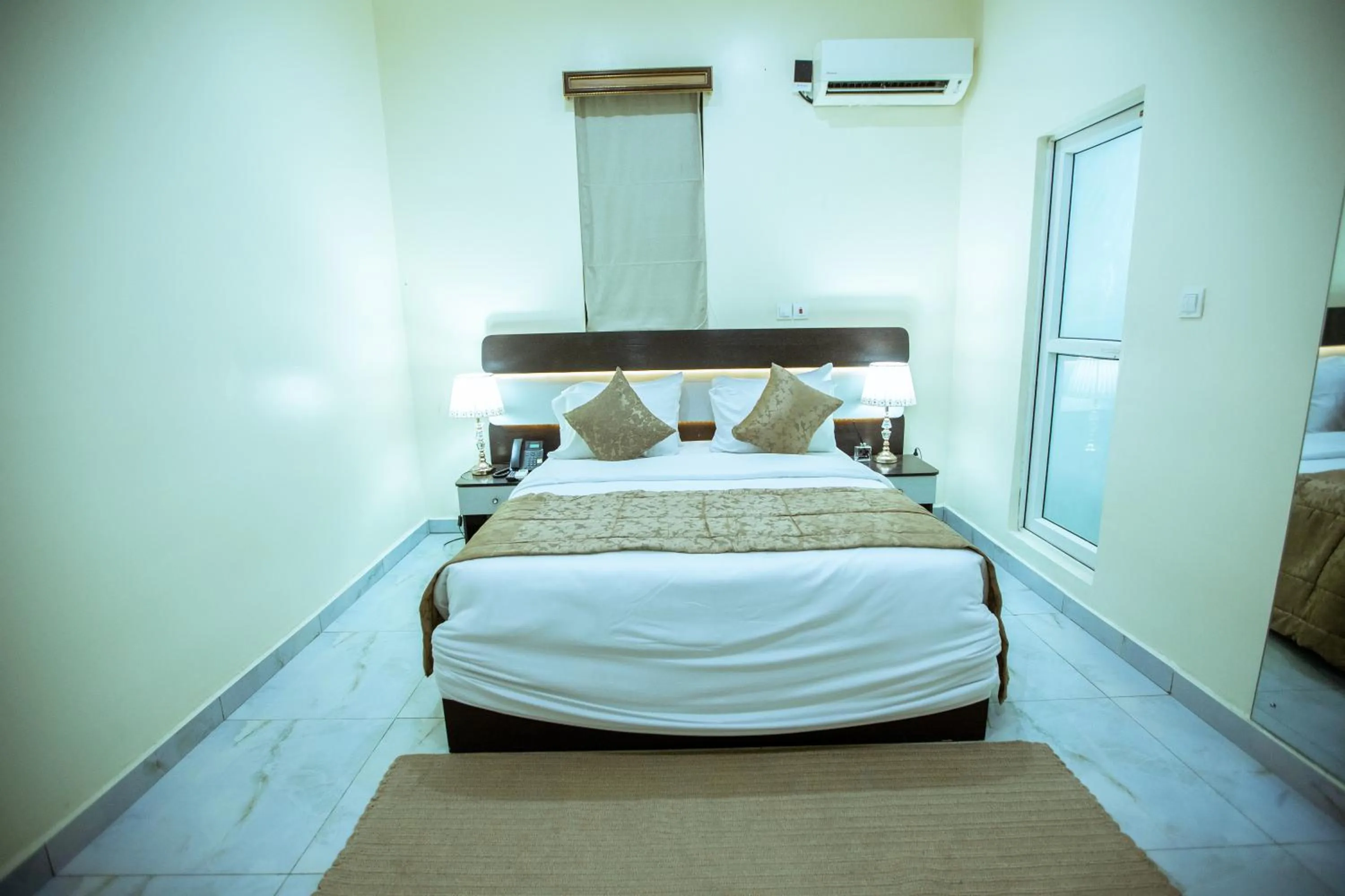 Bed in Providha Hotel & Suites