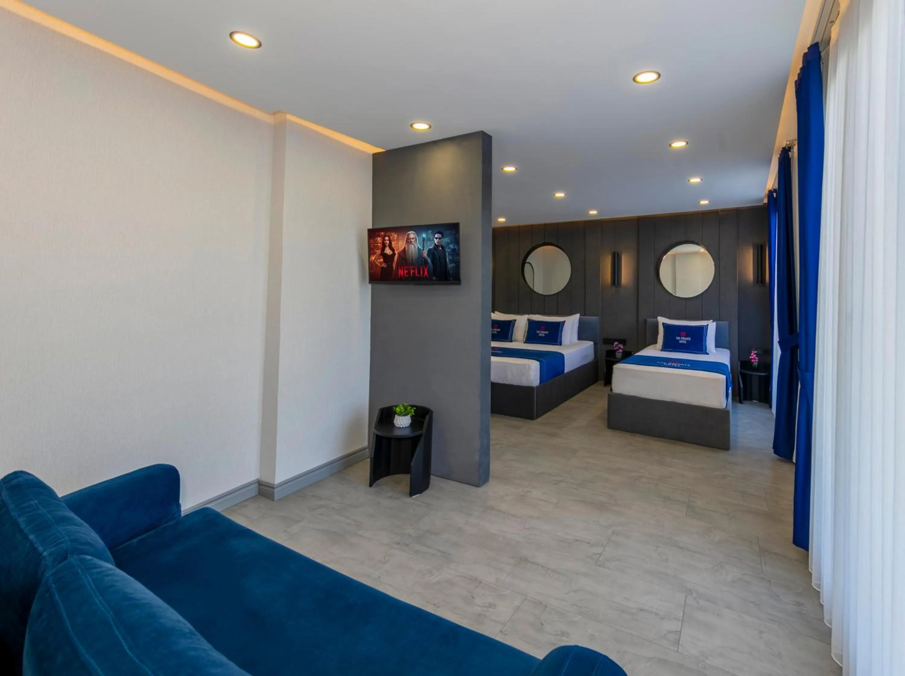 Living room, Bed in The Private Airport Hotel