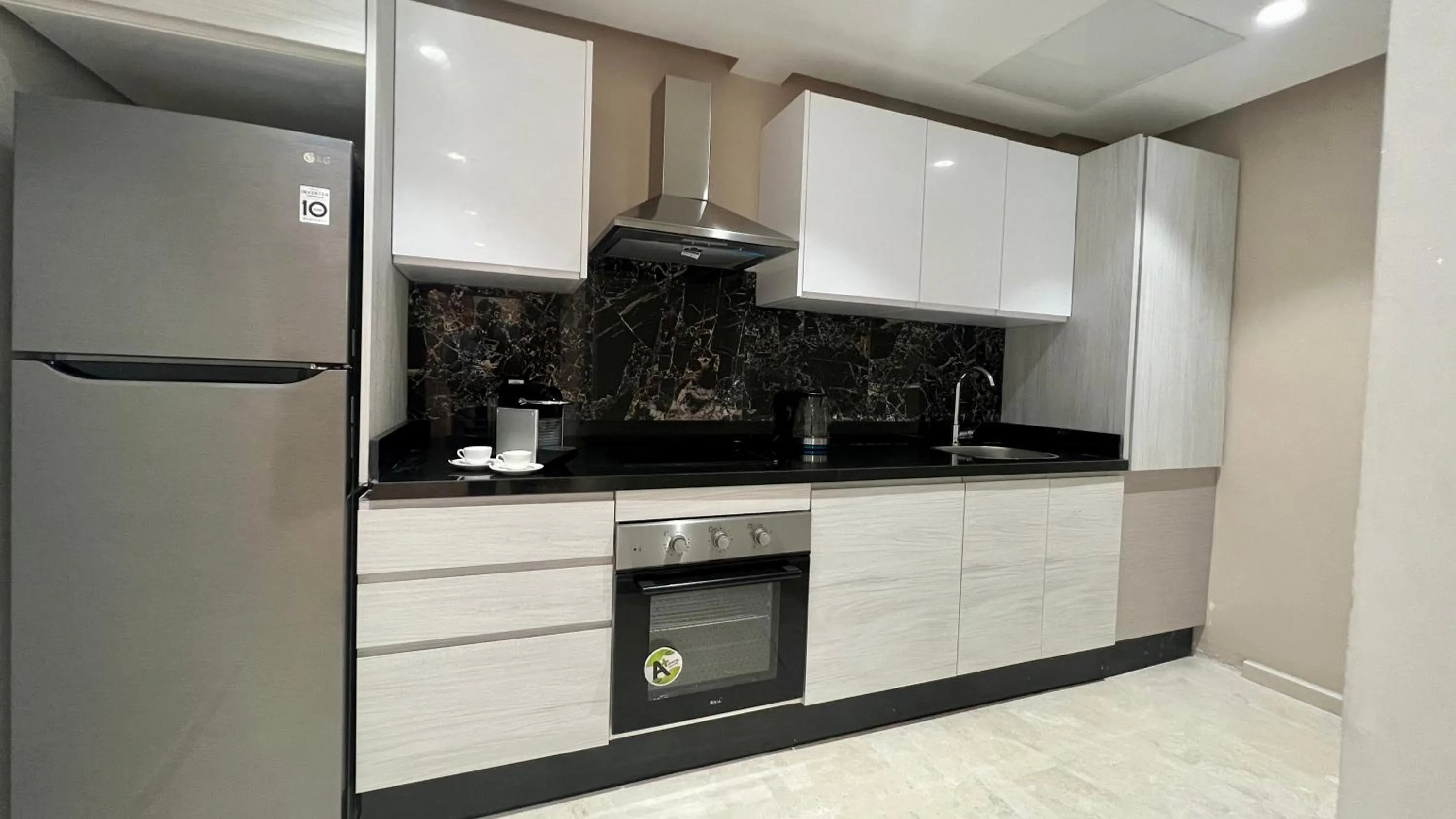 Kitchen or kitchenette in ZEN Suites Hotel Massira