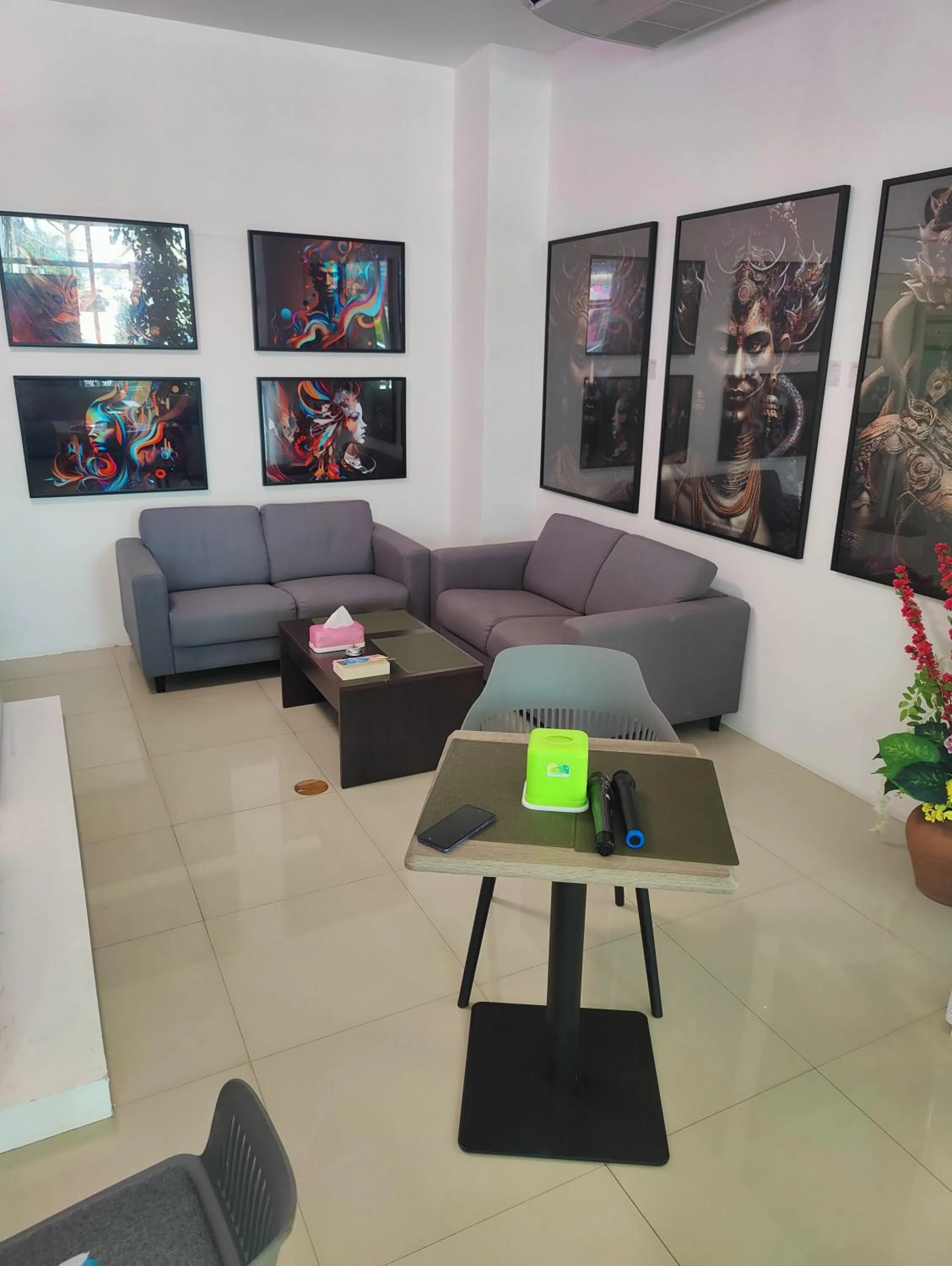 Communal lounge/ TV room in Cafe Nana Hotel