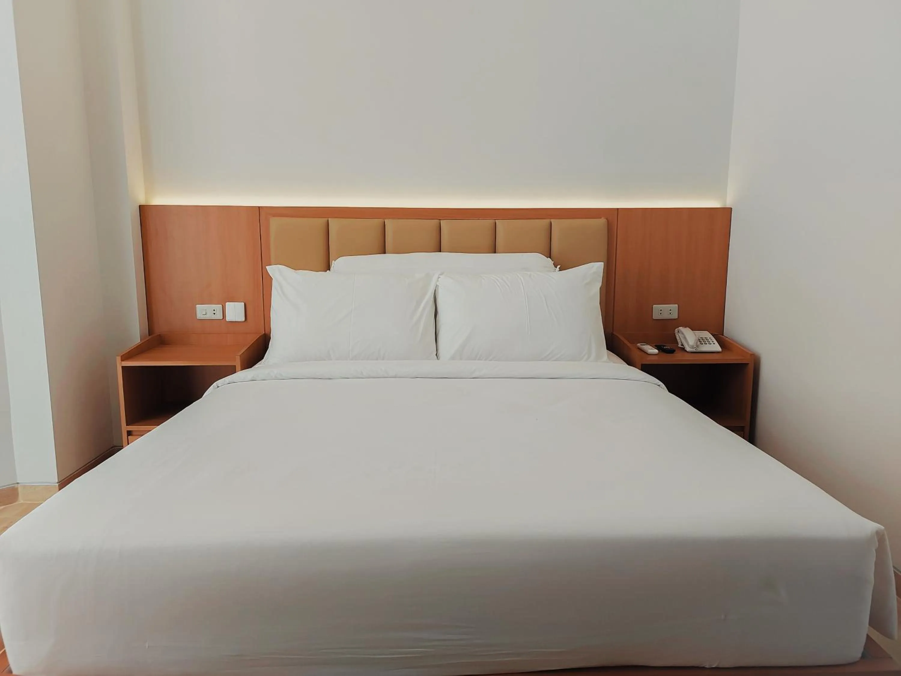 Bed in AYMAN SYARIAH HOTEL