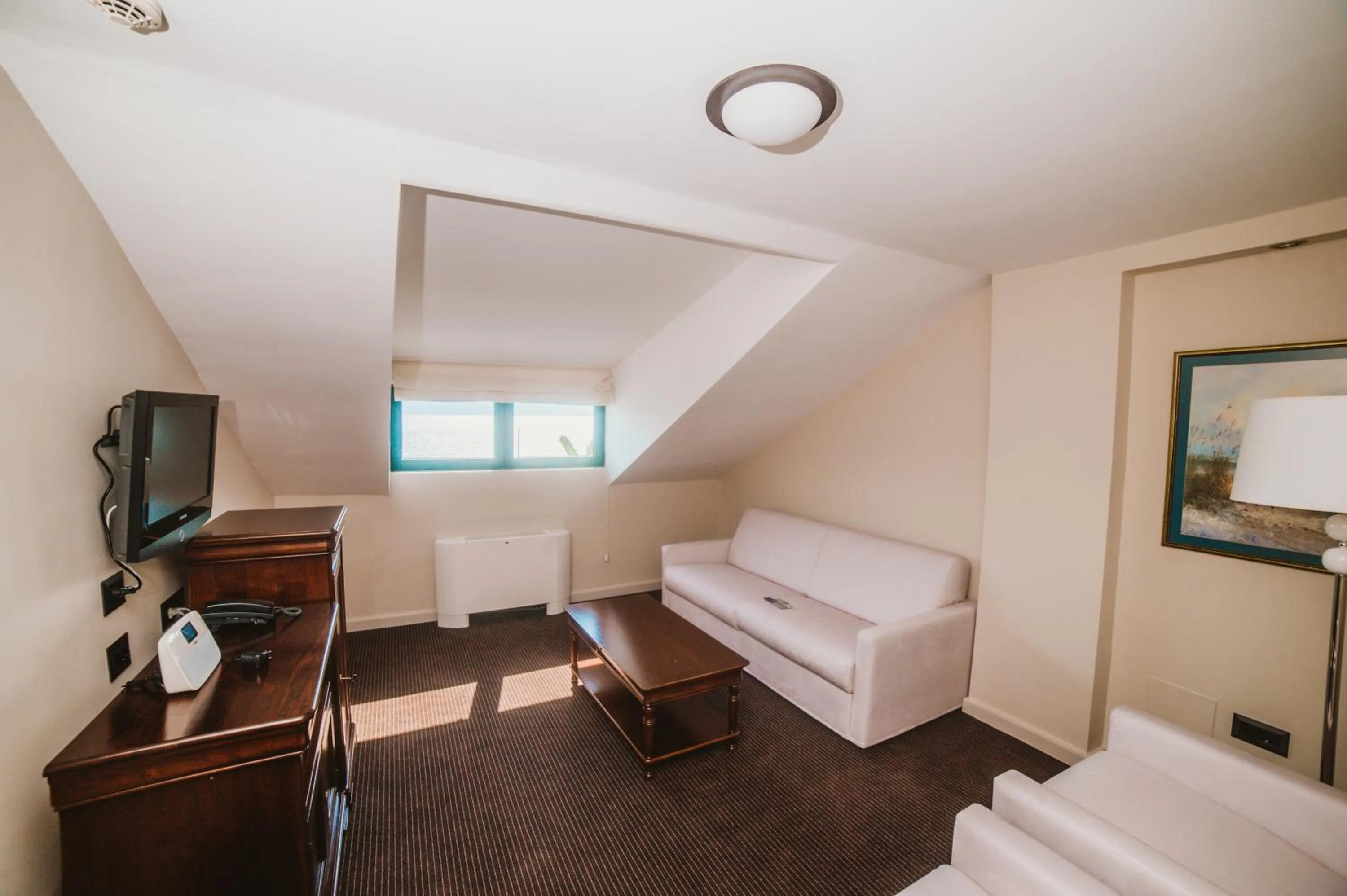 Living room, Bed in Hotel Astoria