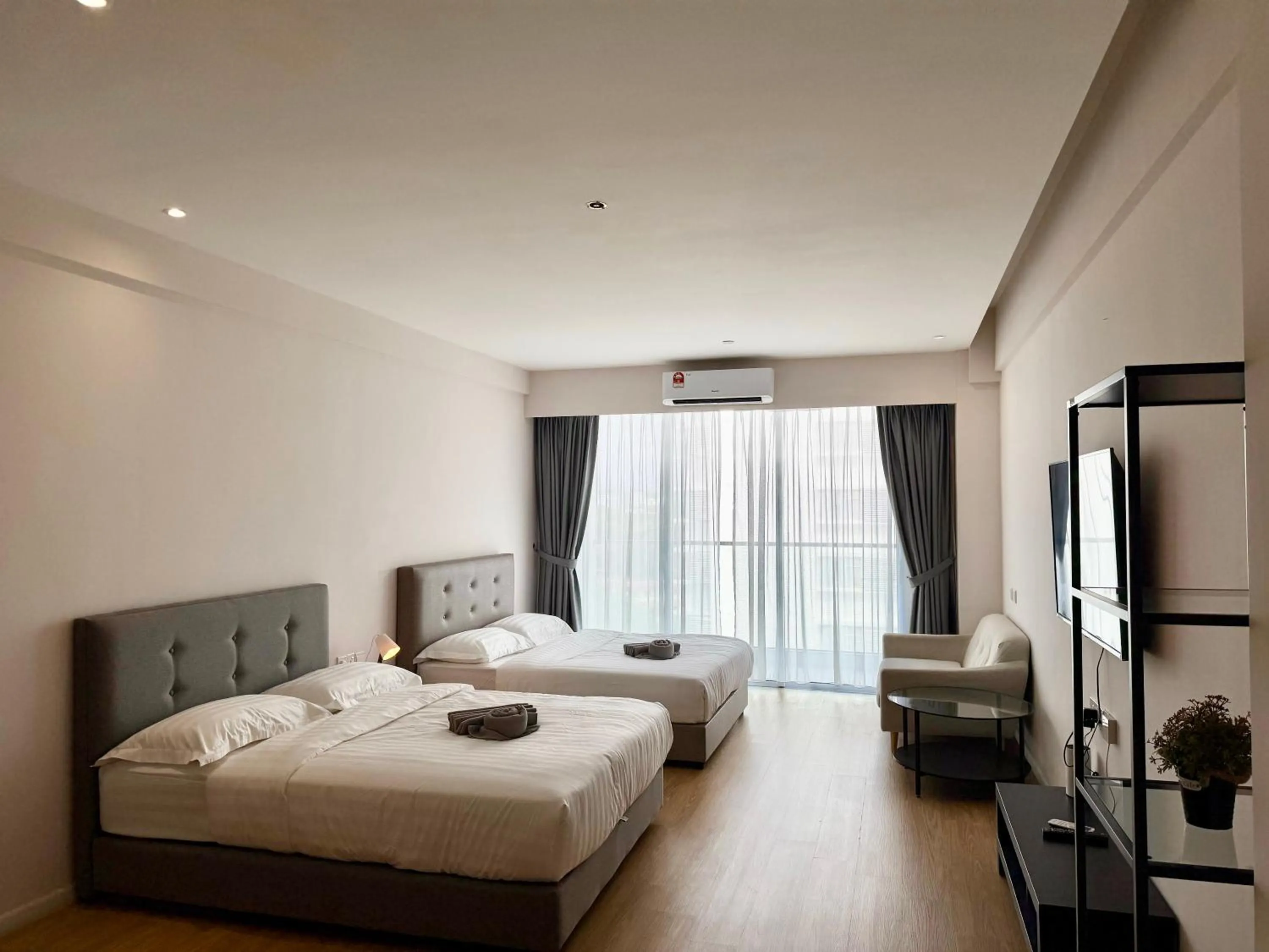 Living room, Bed in Deco Home @ Aru Suites