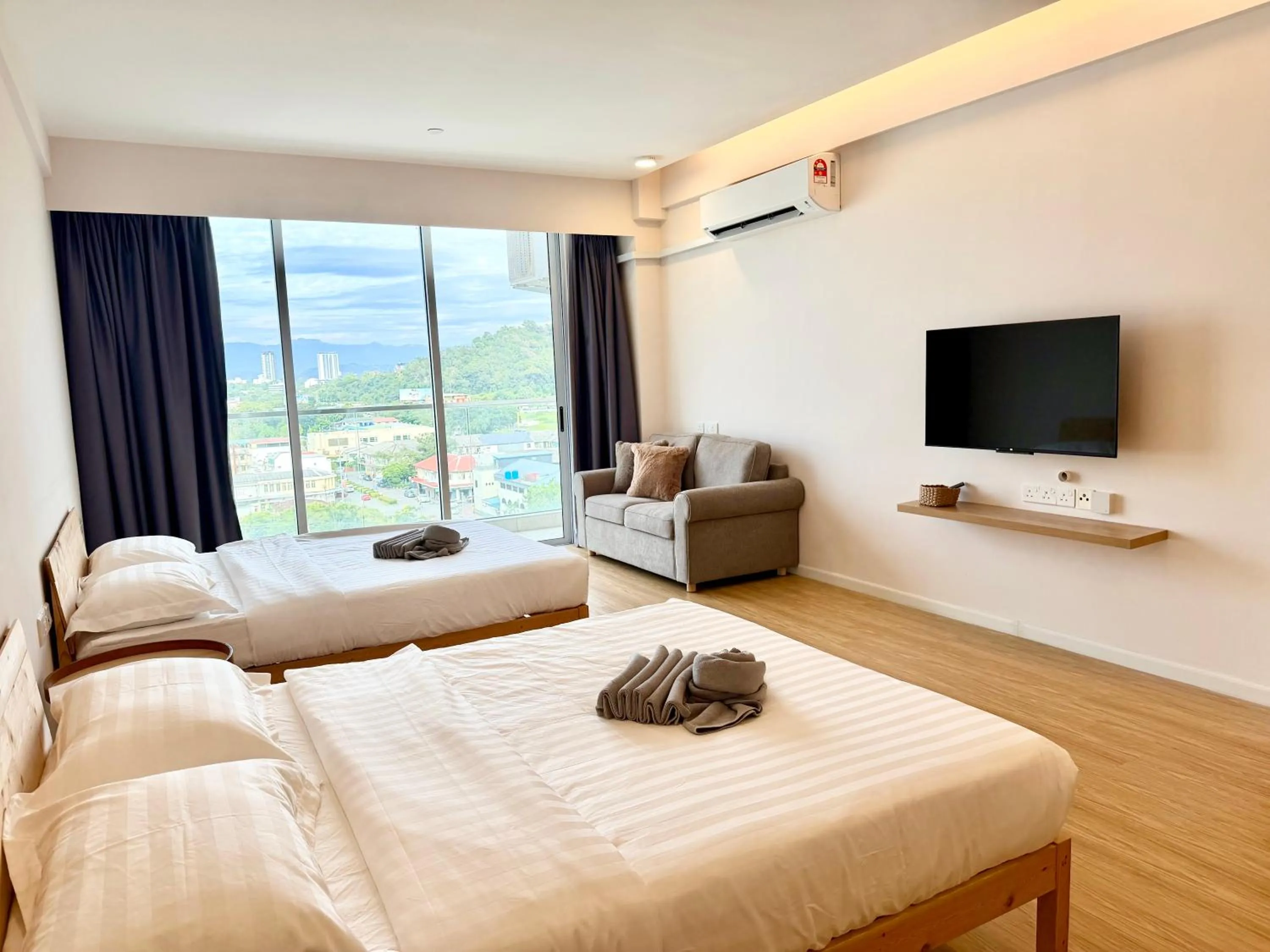 Living room, Bed in Deco Home @ Aru Suites