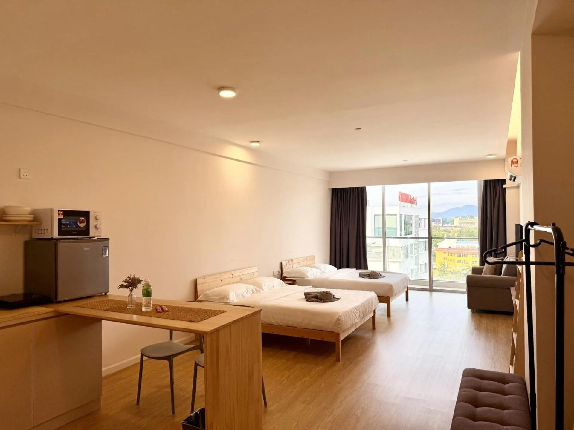 Living room, Bed in Deco Home @ Aru Suites