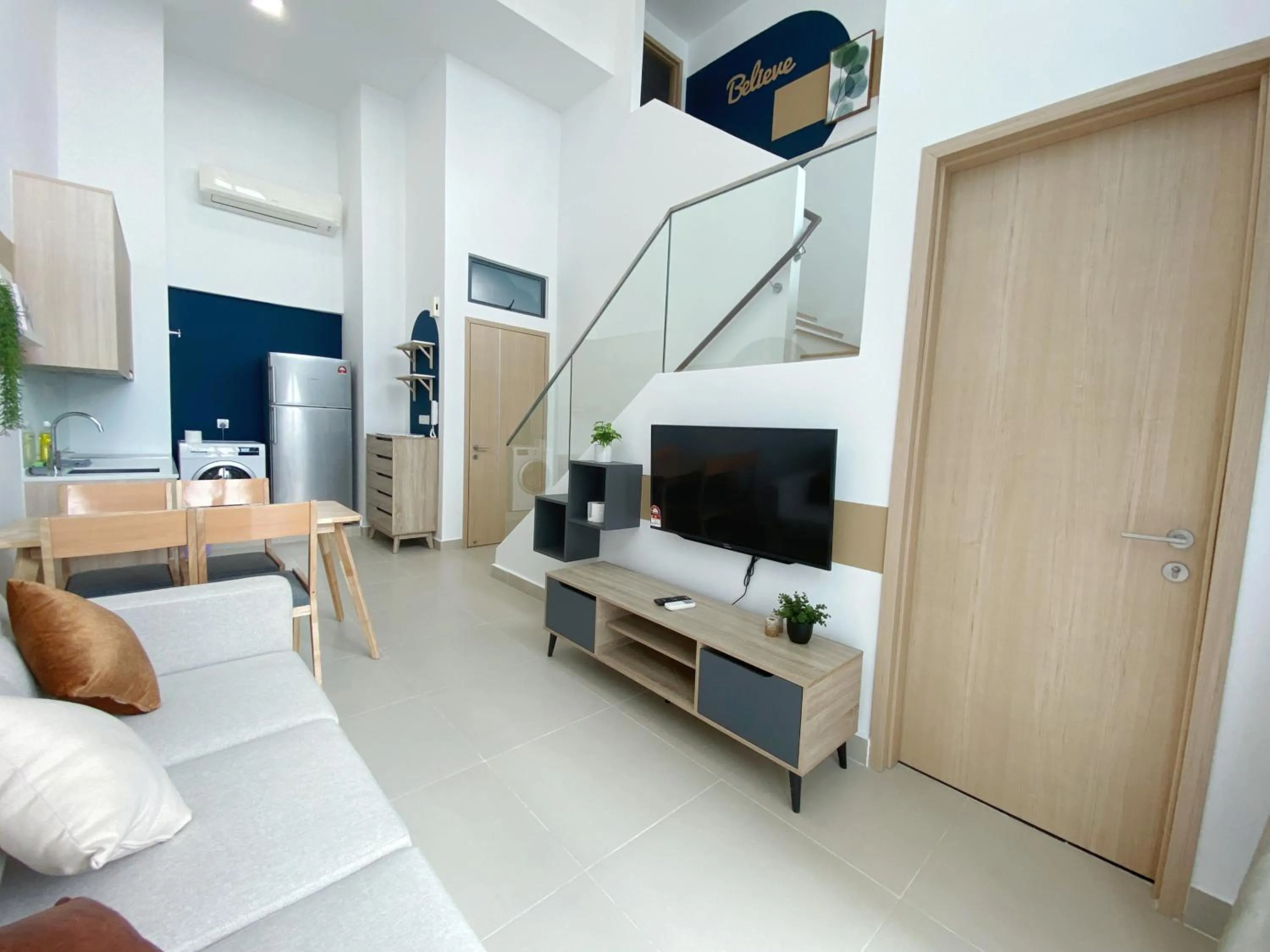 Communal lounge/ TV room in The Colony By Infinitum By Awesomestay