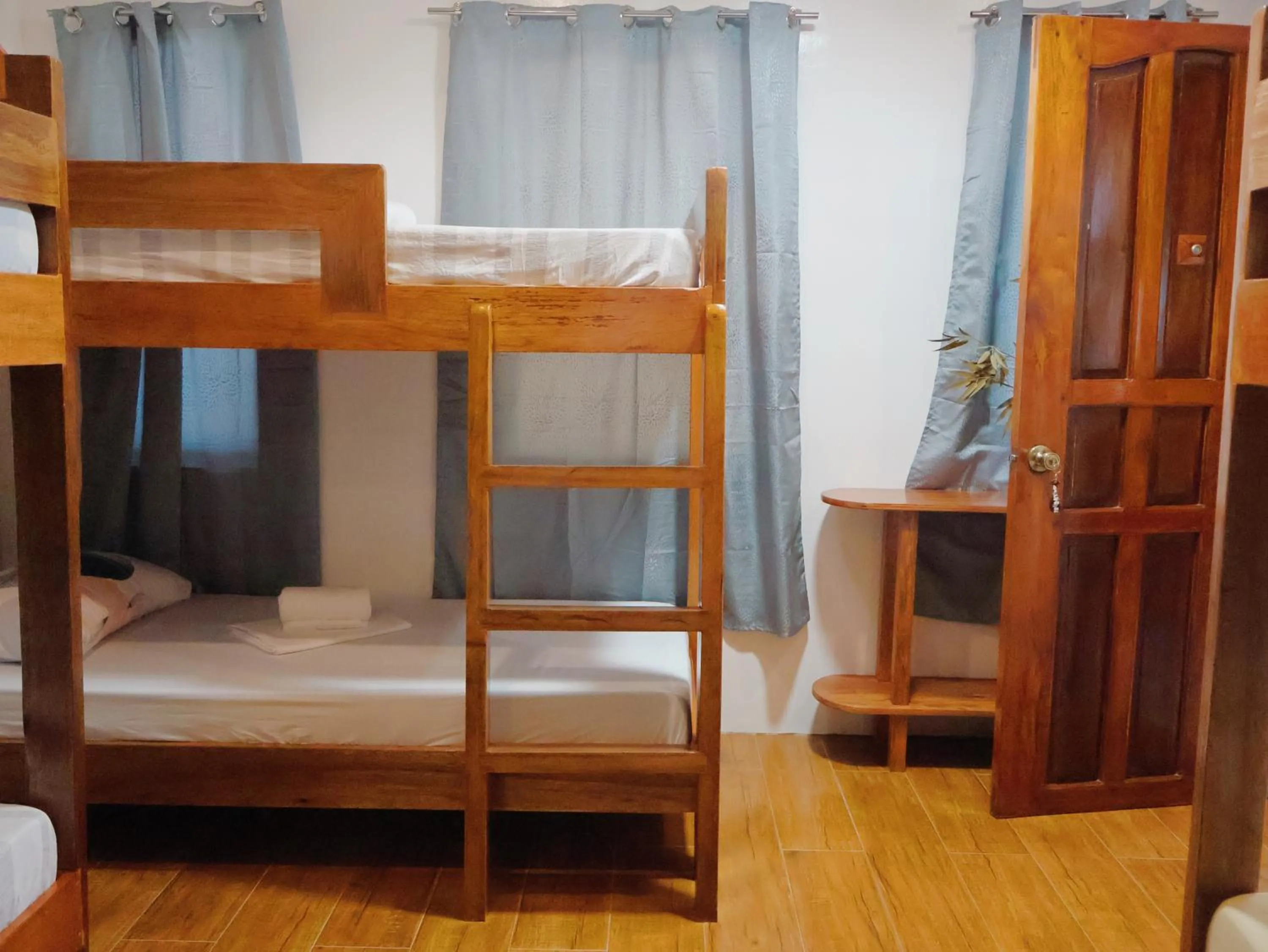 Bed in LANGOJON JIANJOY BEACH RESORT