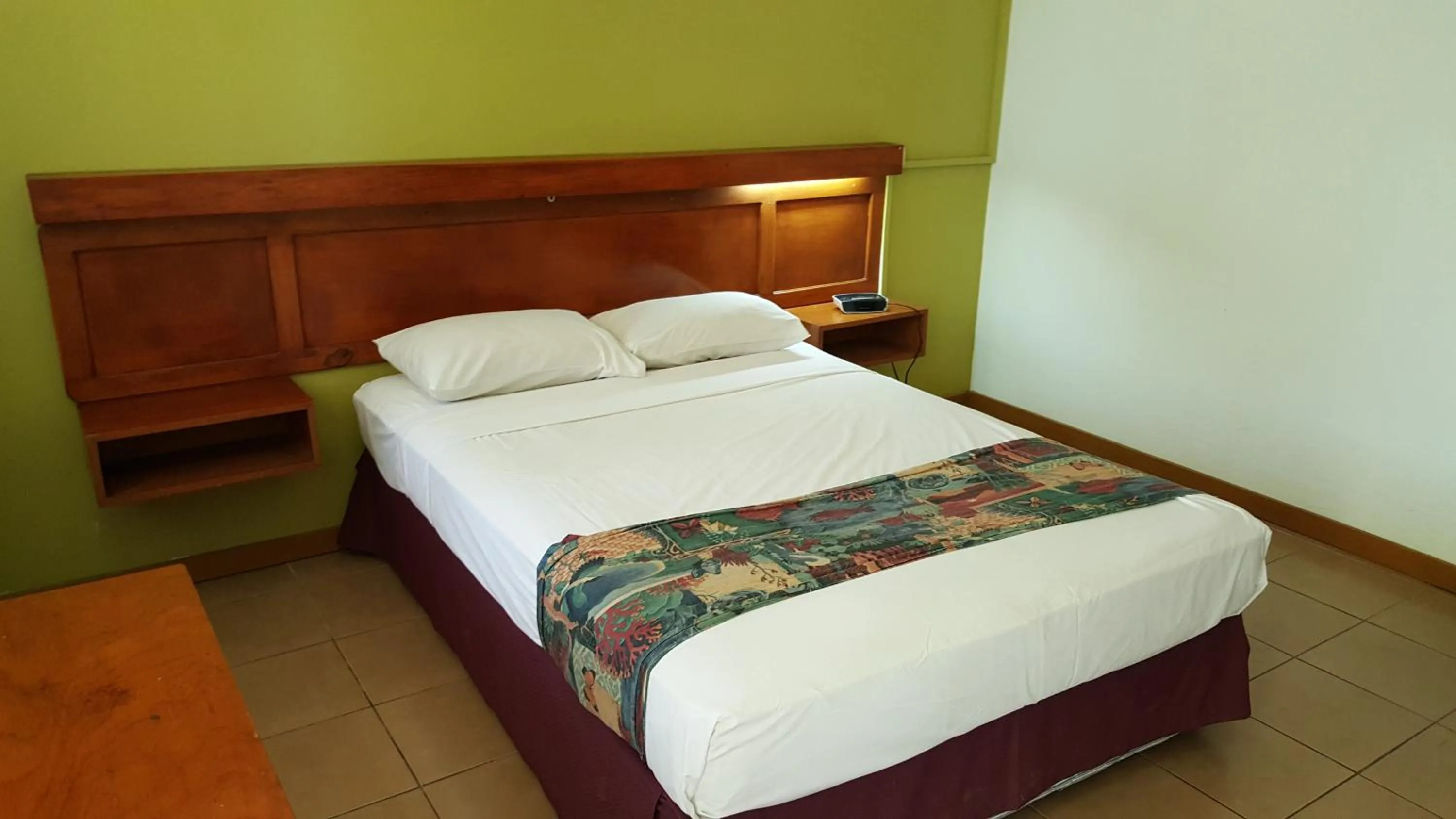 Bed in Hexagon International Hotel, Villas & Spa