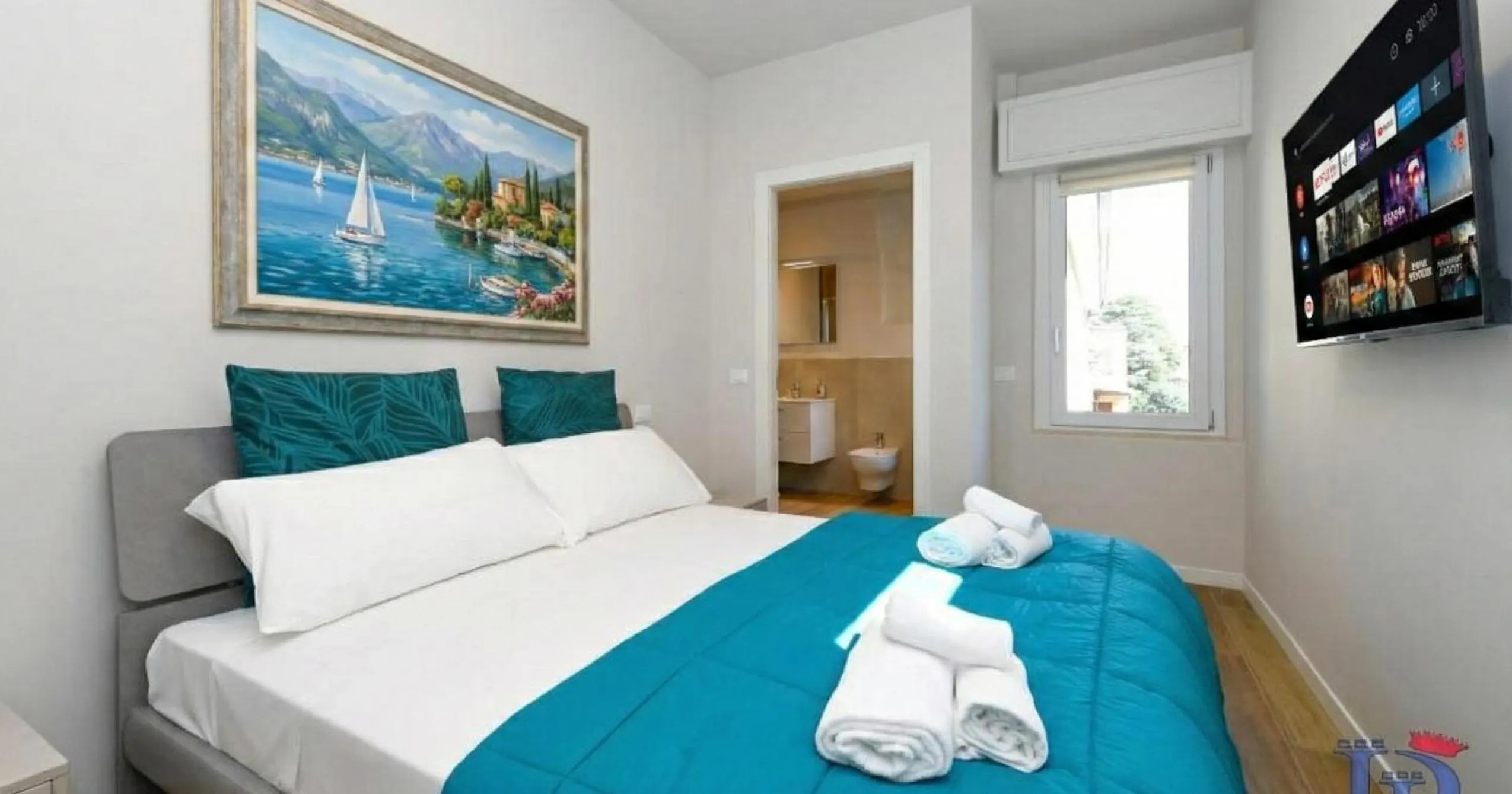 TV and multimedia, Bed in Cappuccino Apartment DesenzanoLoft Official Partner Homes & Villas by Marriott Bonvoy