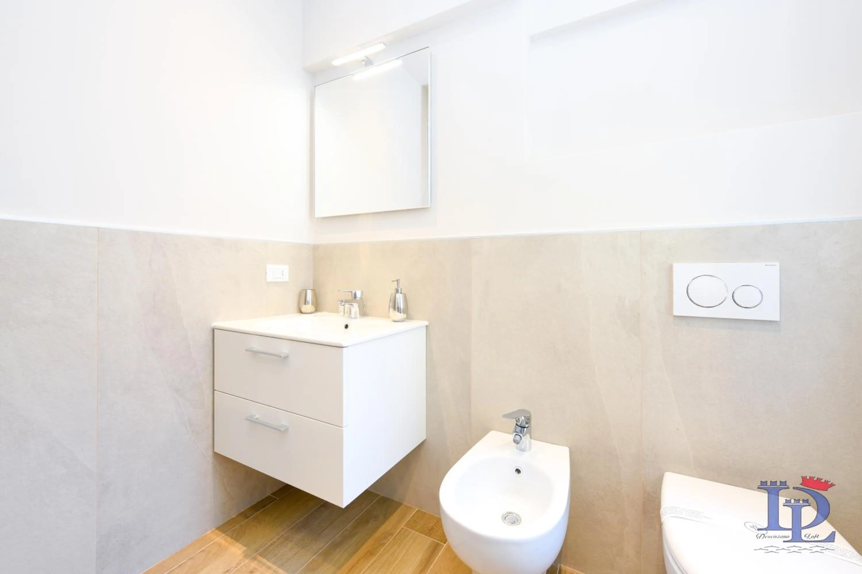 Toilet in Cappuccino Apartment DesenzanoLoft Official Partner Homes & Villas by Marriott Bonvoy