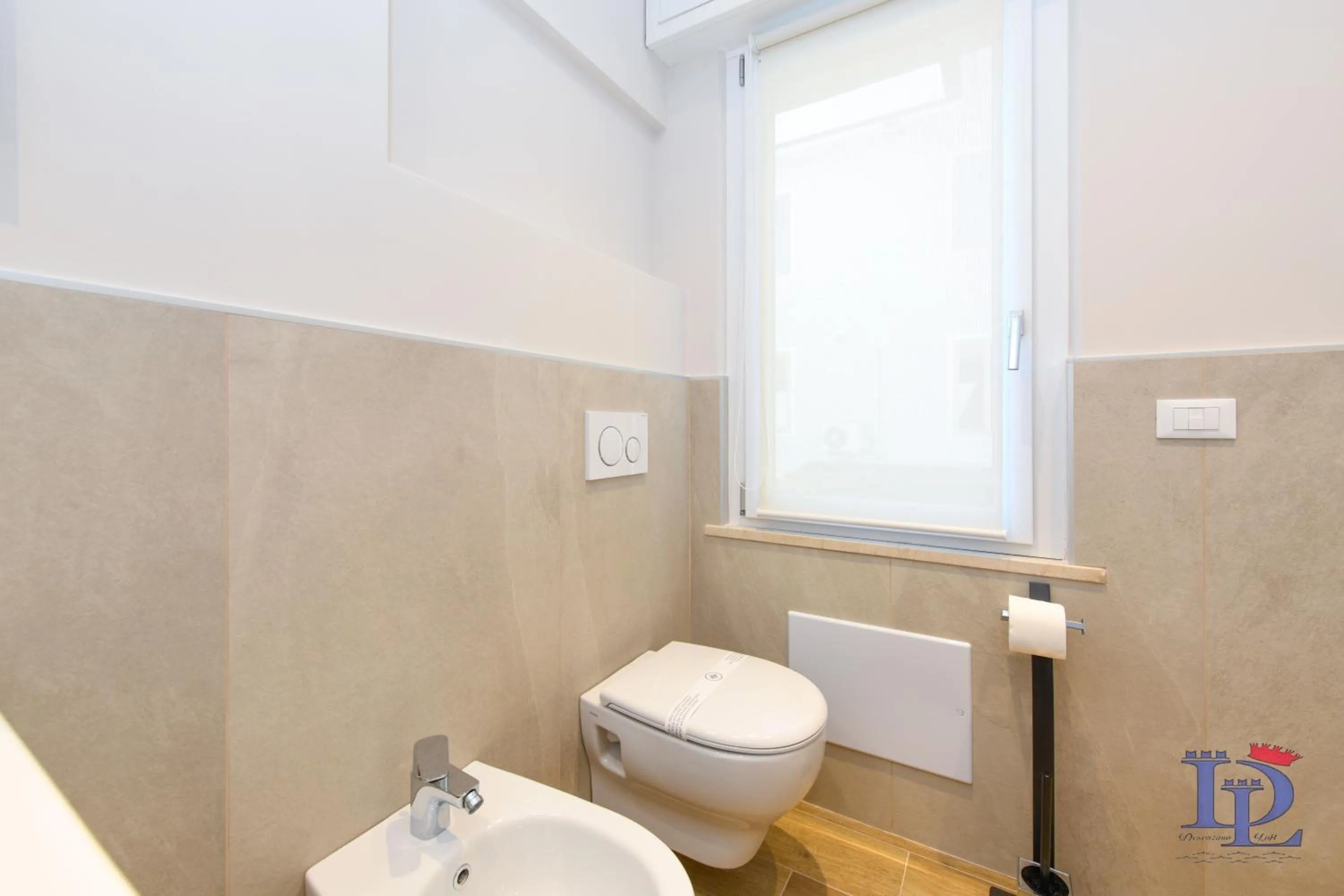 Toilet in Cappuccino Apartment DesenzanoLoft Official Partner Homes & Villas by Marriott Bonvoy