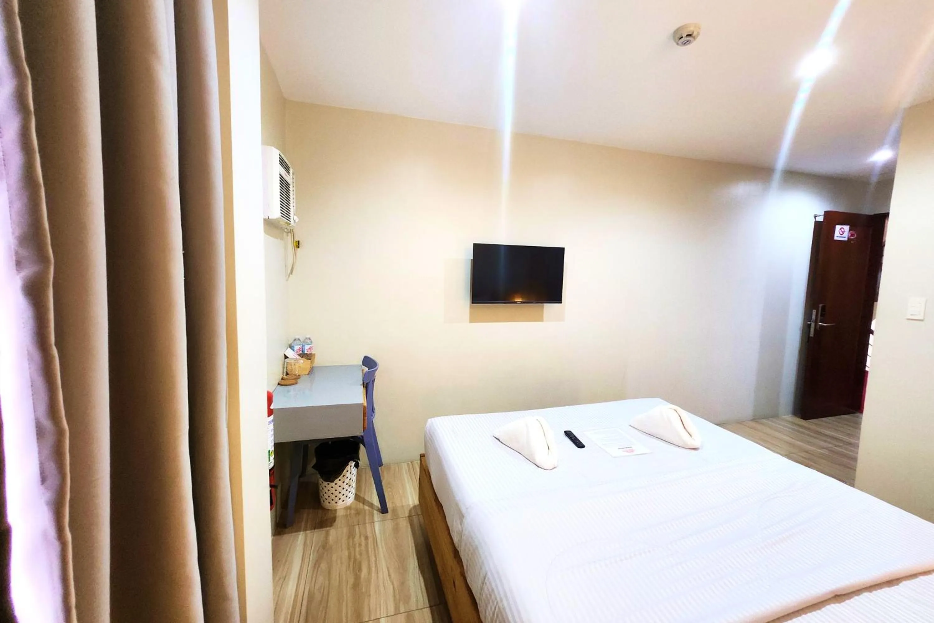 Bed in DLT Suites Cebu powered by Cocotel