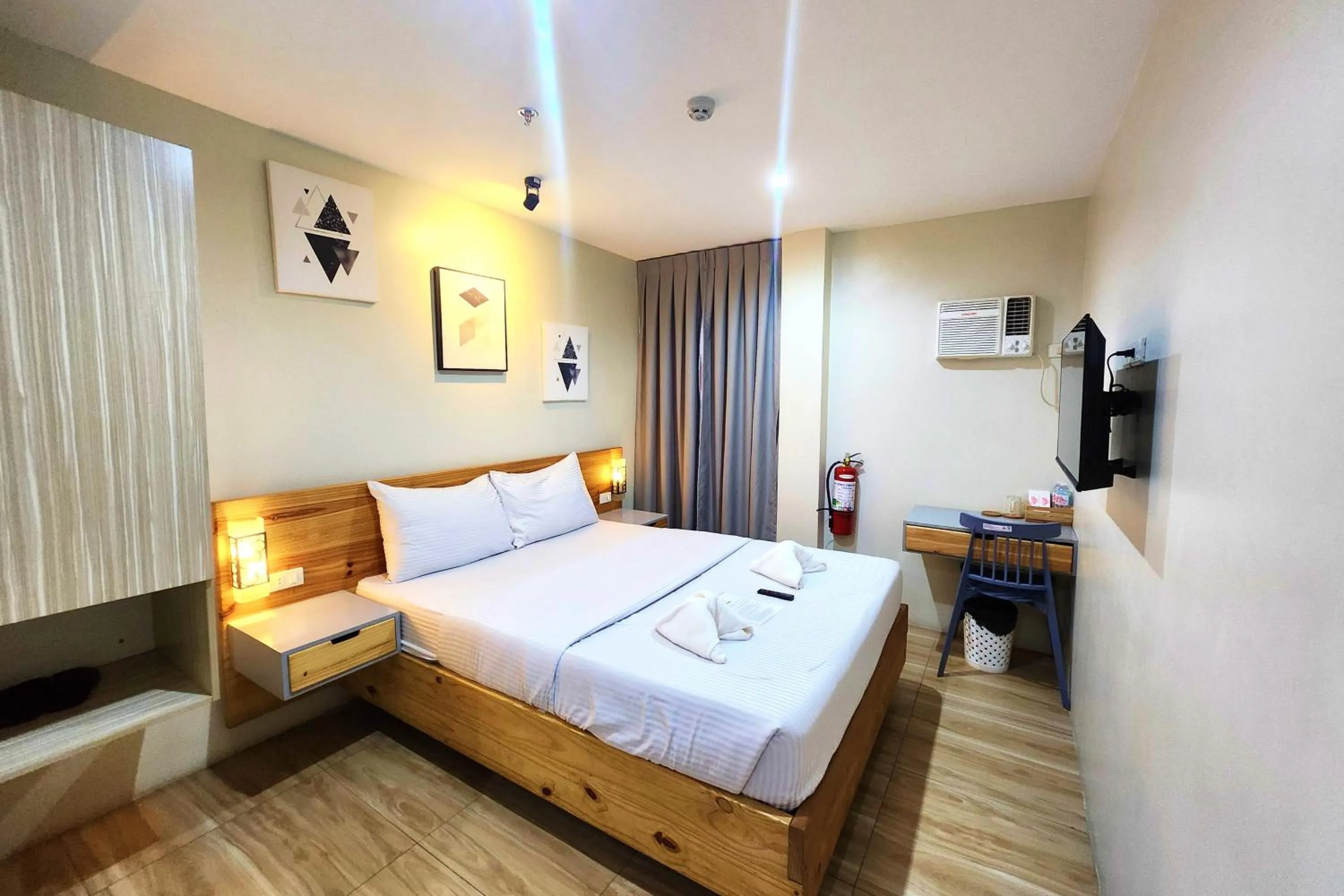 Bed in DLT Suites Cebu powered by Cocotel