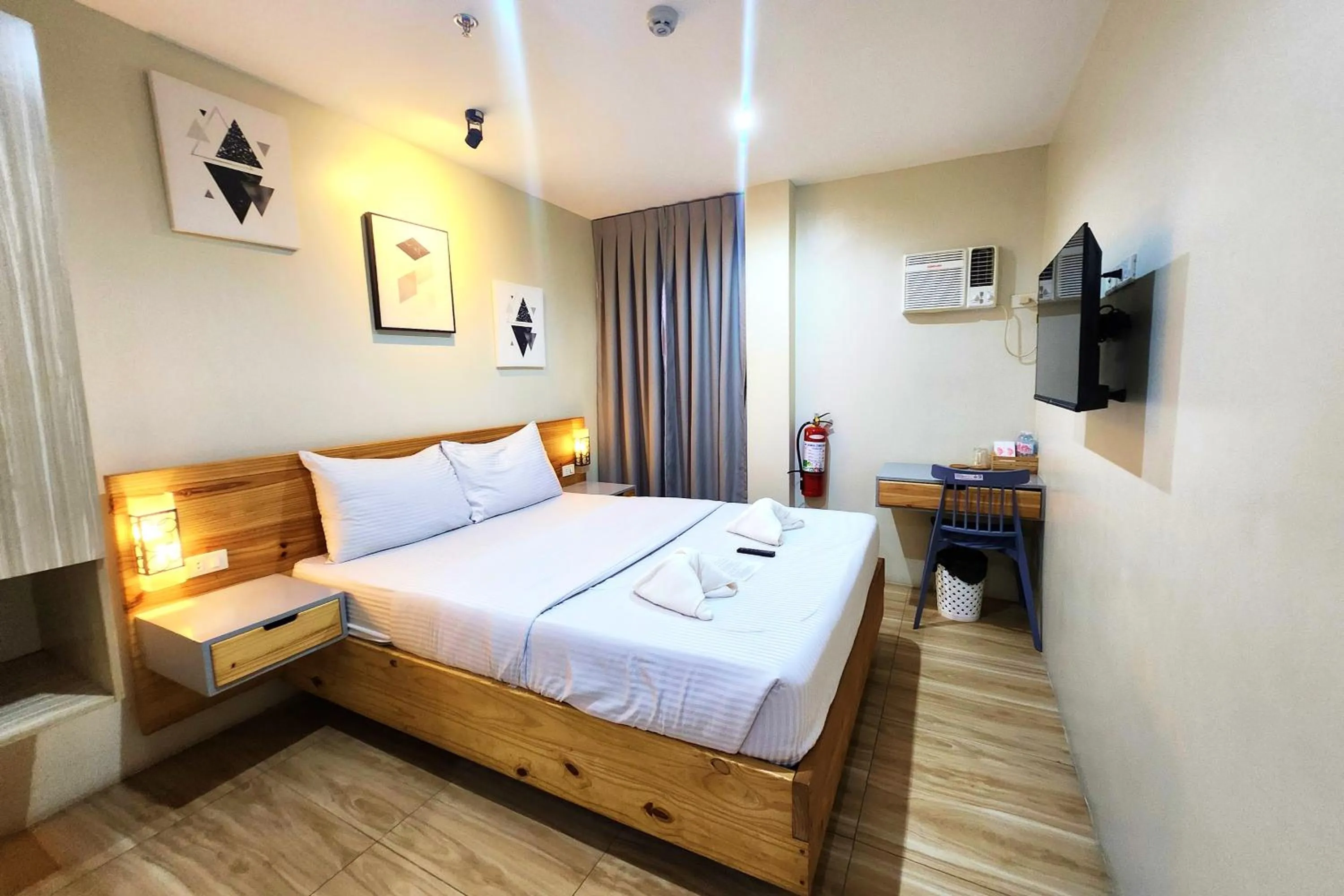 Bed in DLT Suites Cebu powered by Cocotel