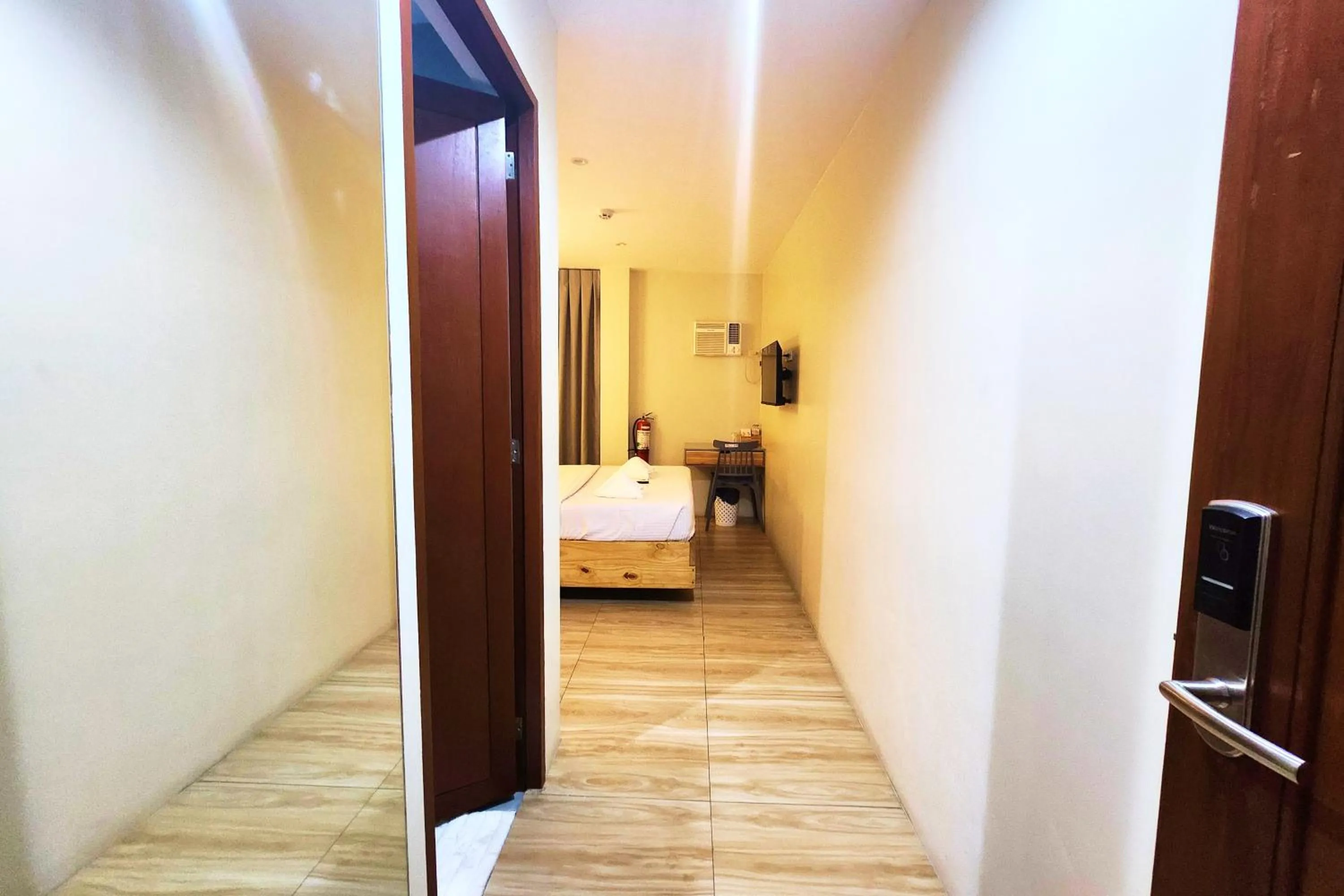 Bed in DLT Suites Cebu powered by Cocotel