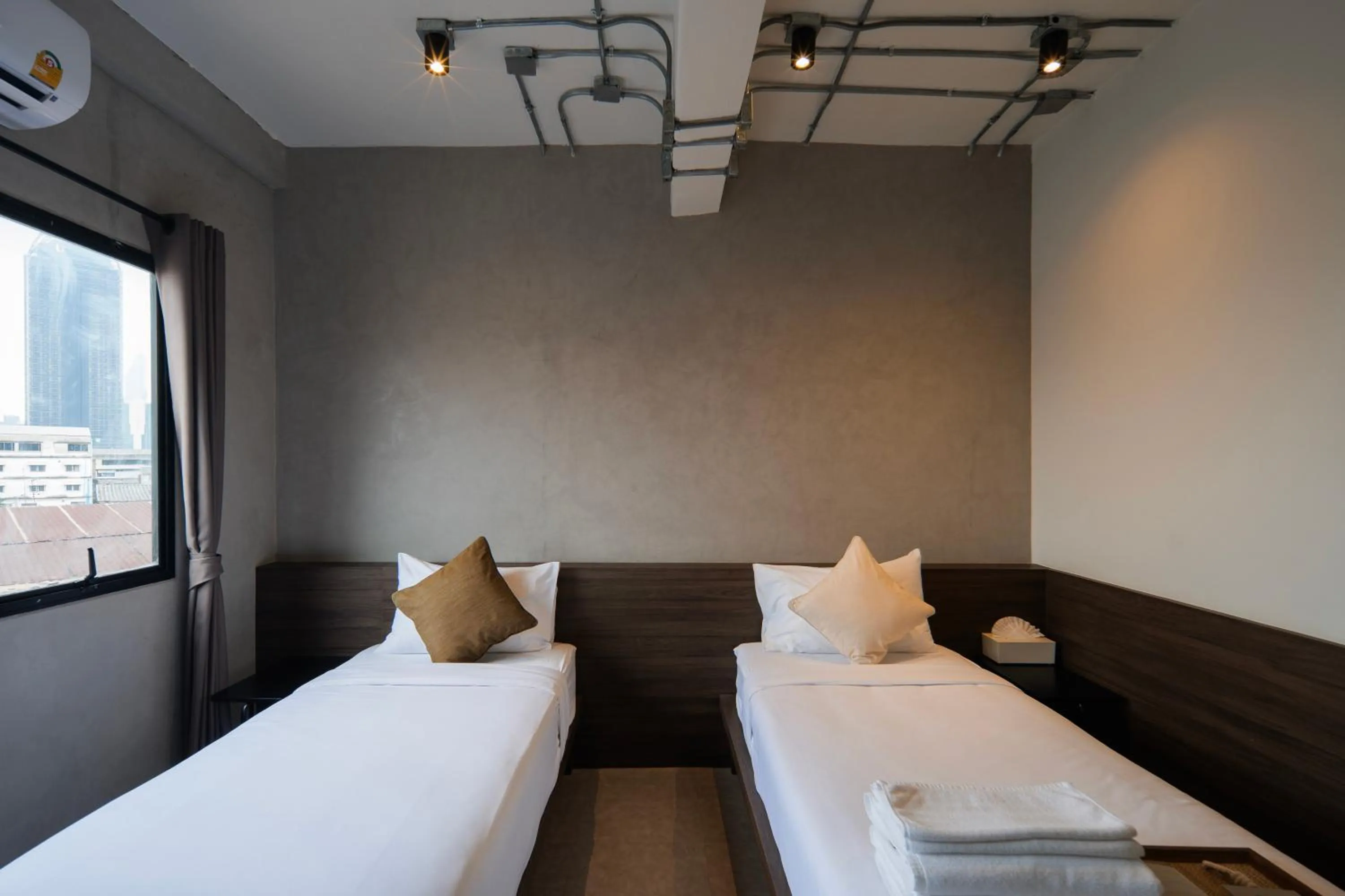 Bed in C'HOUSE Bangkok