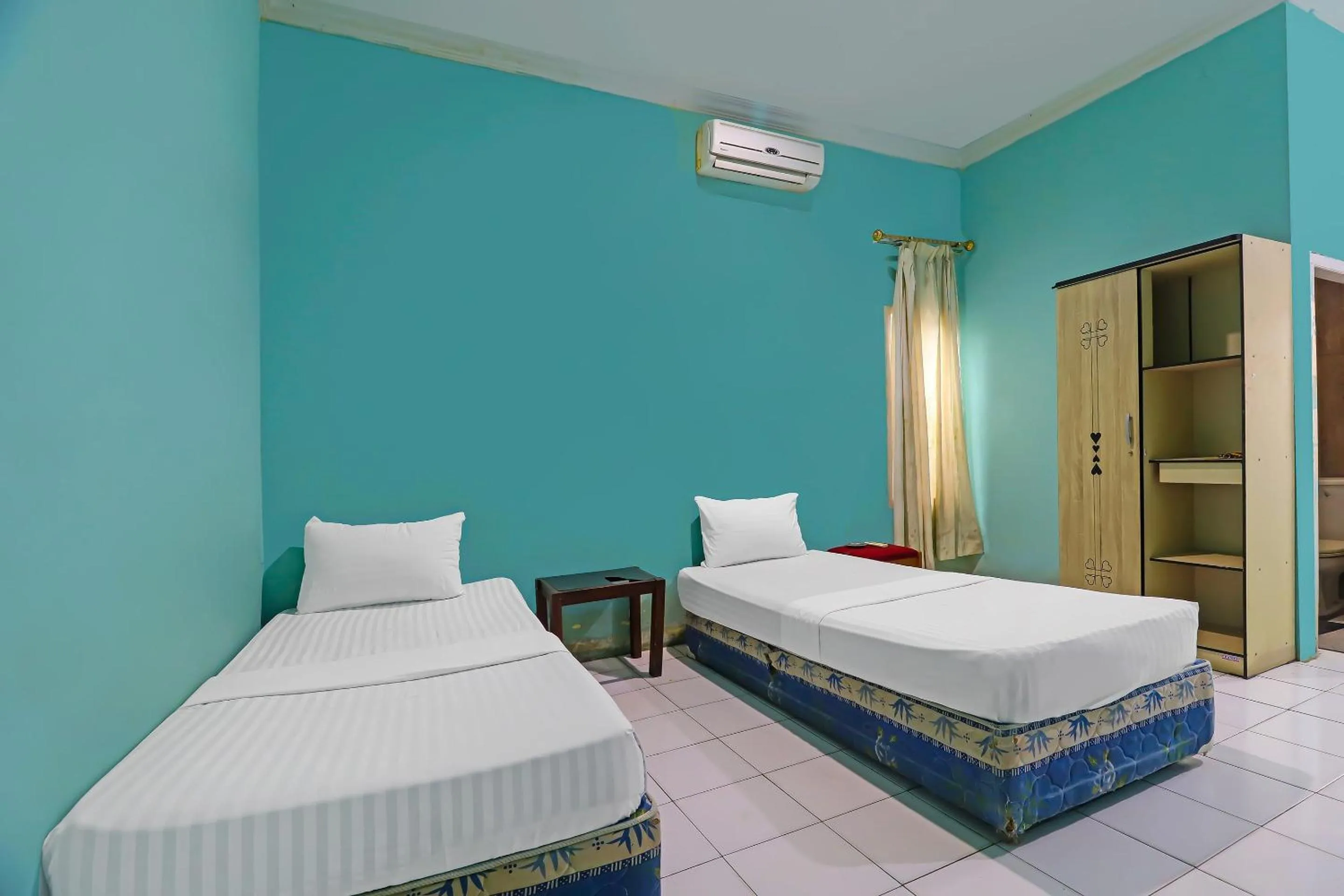 Bedroom in Hotel O Wisma Permata Syariah