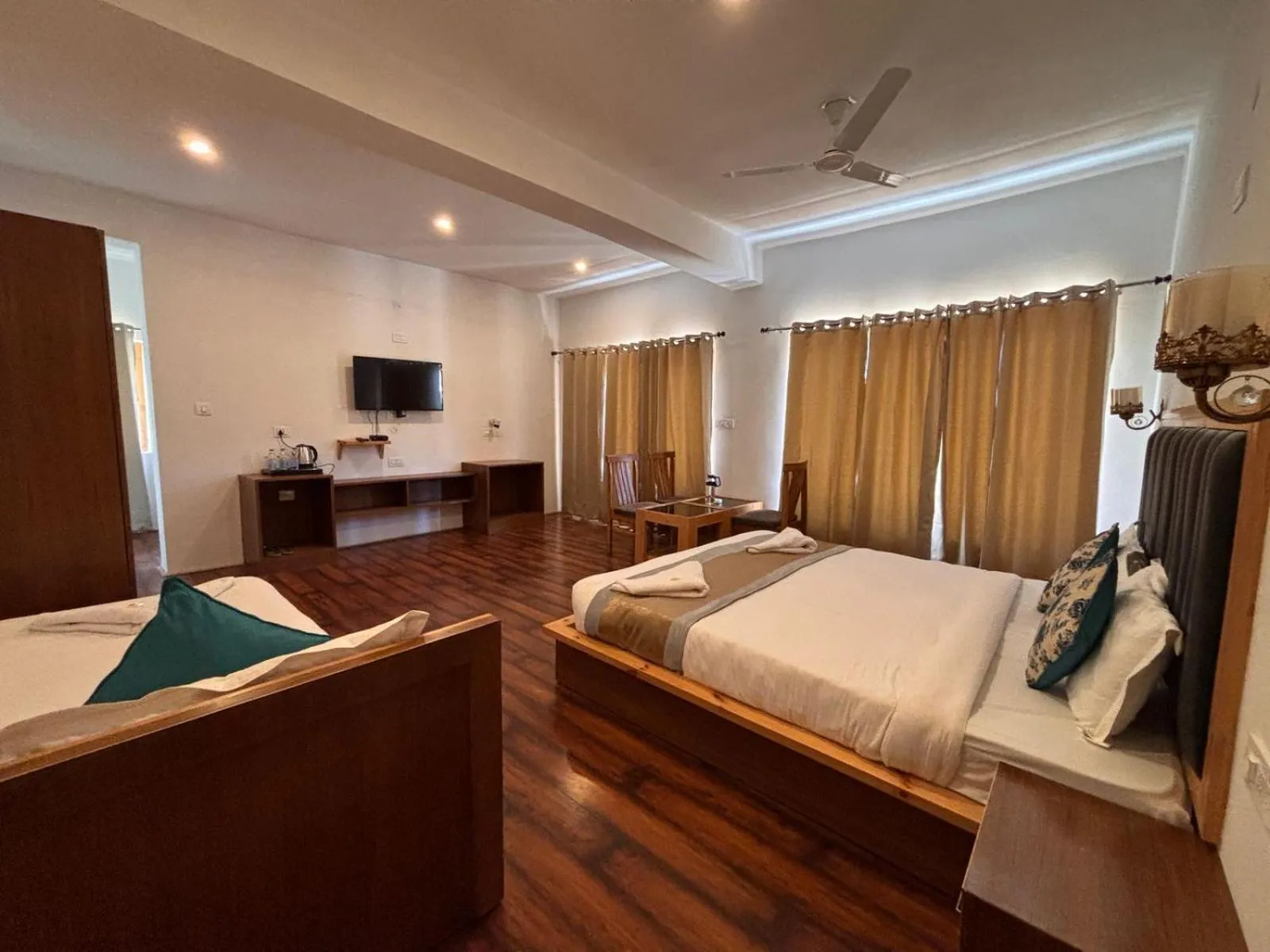 Communal lounge/ TV room, Bed in LADAKH ODYSSEY Hotel