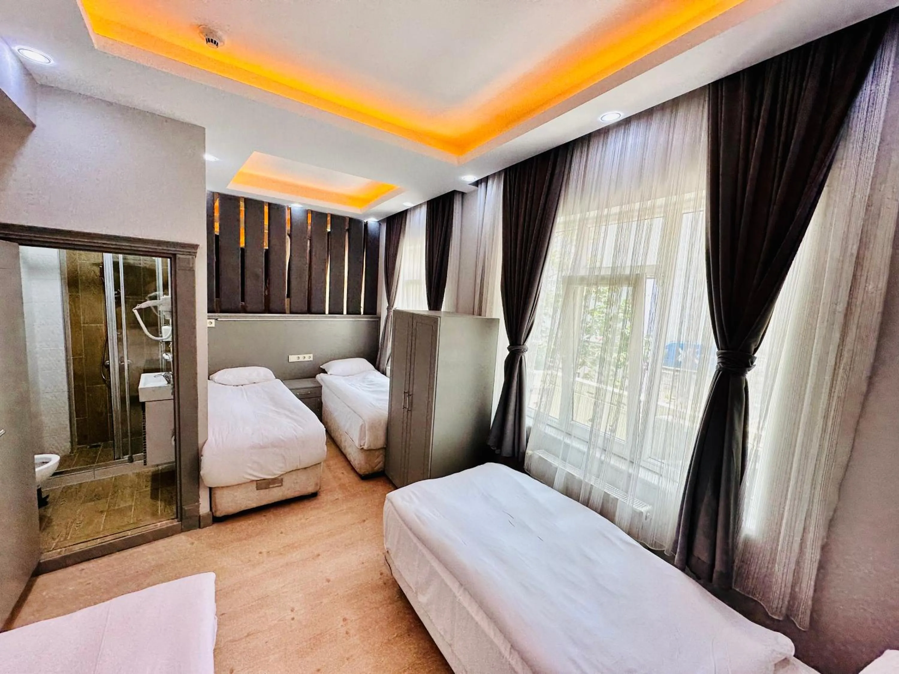 Bed in Crowned Plus Hotel