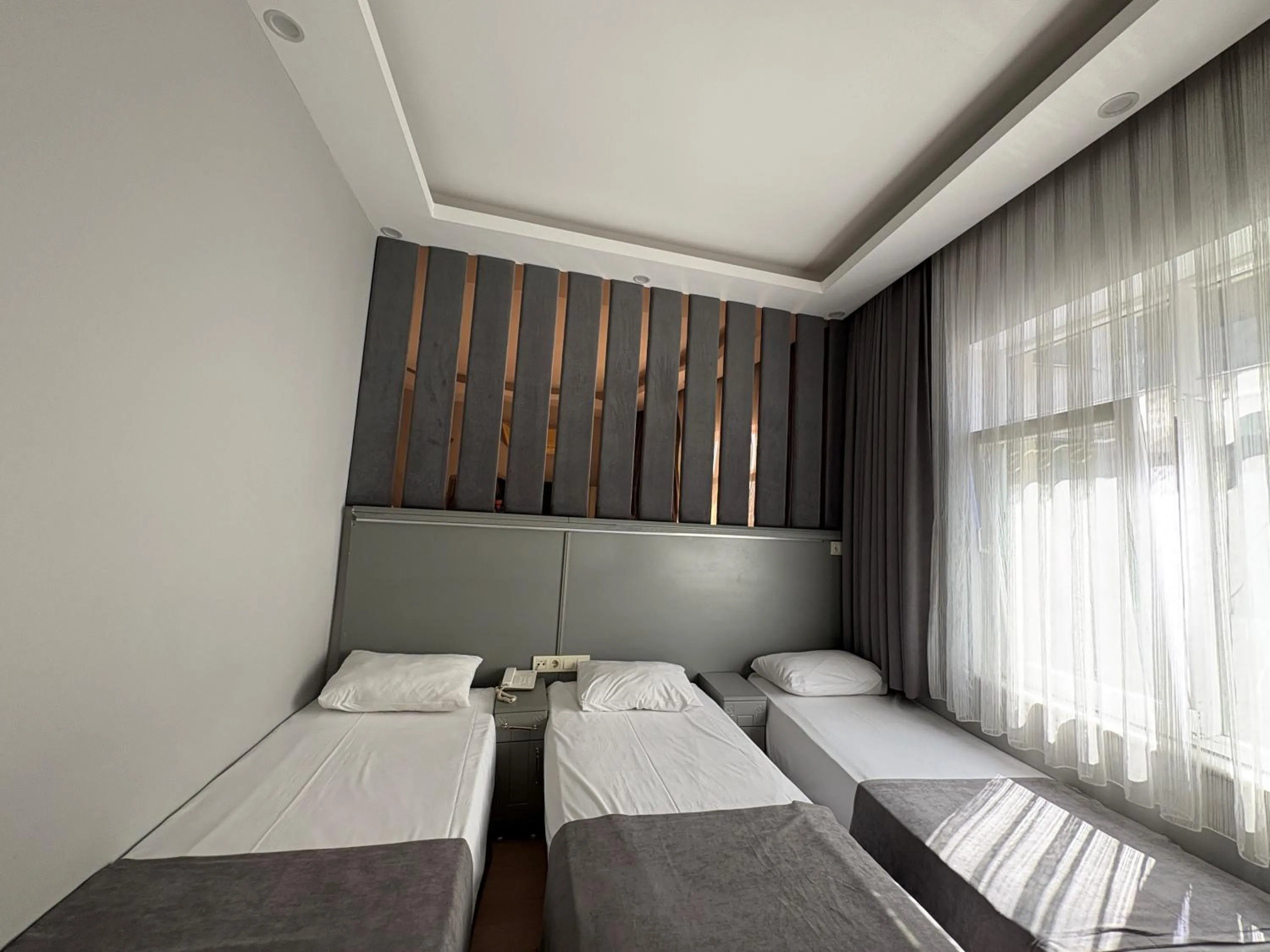 Bed in Crowned Plus Hotel