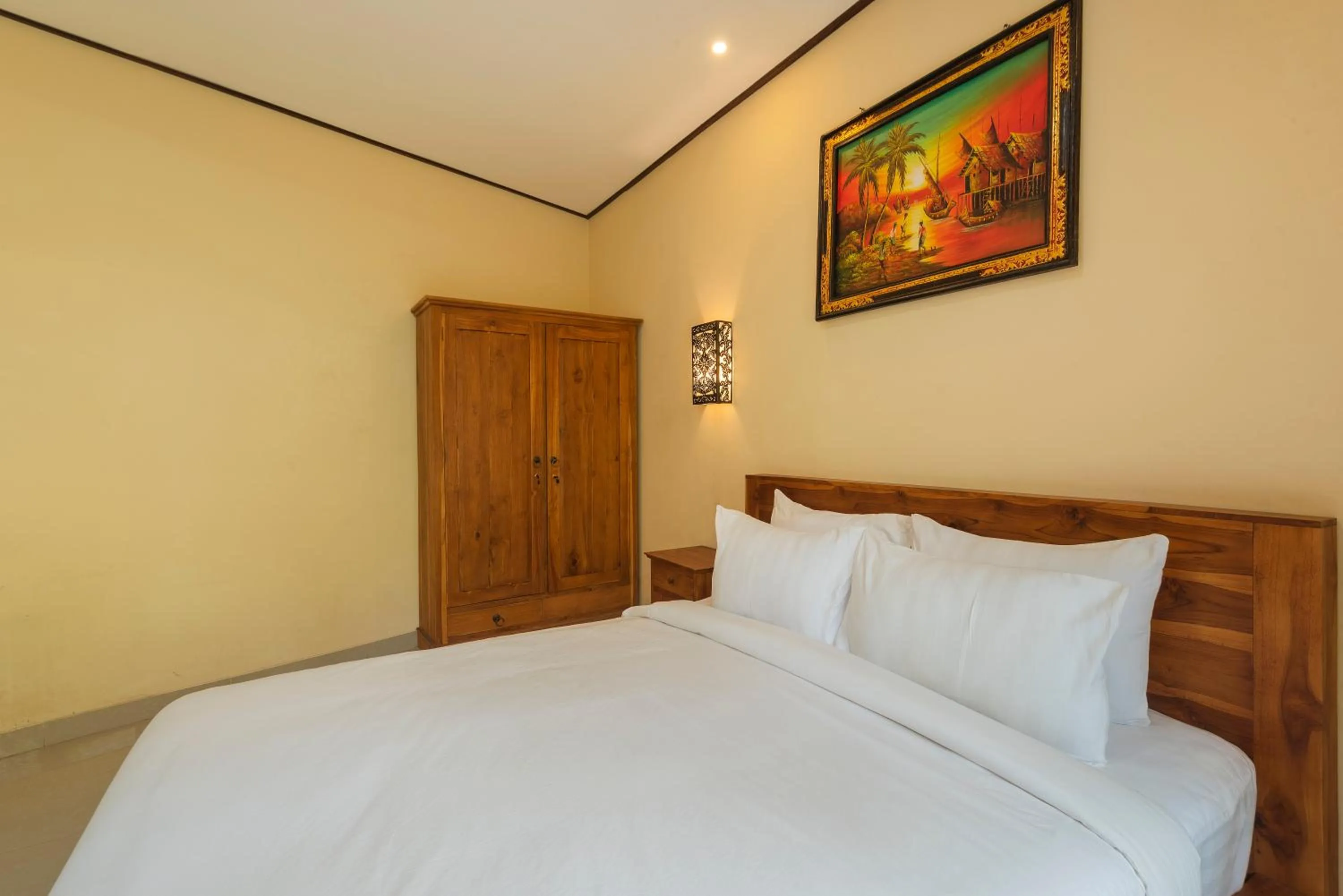 Bed in Liliy Guest House Legian