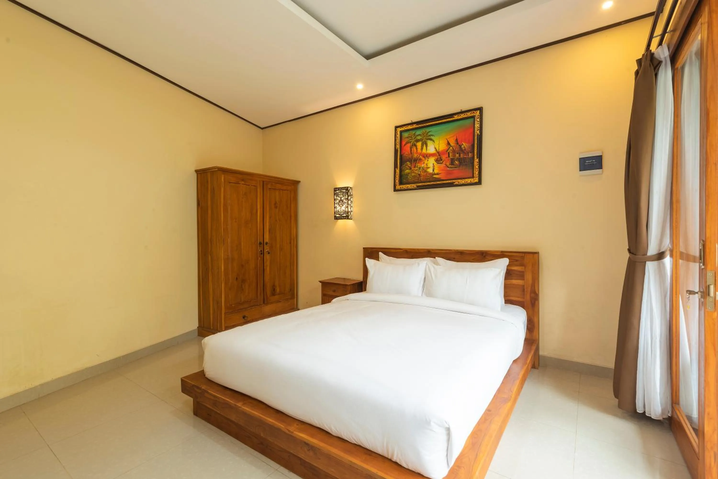 Bed in Liliy Guest House Legian