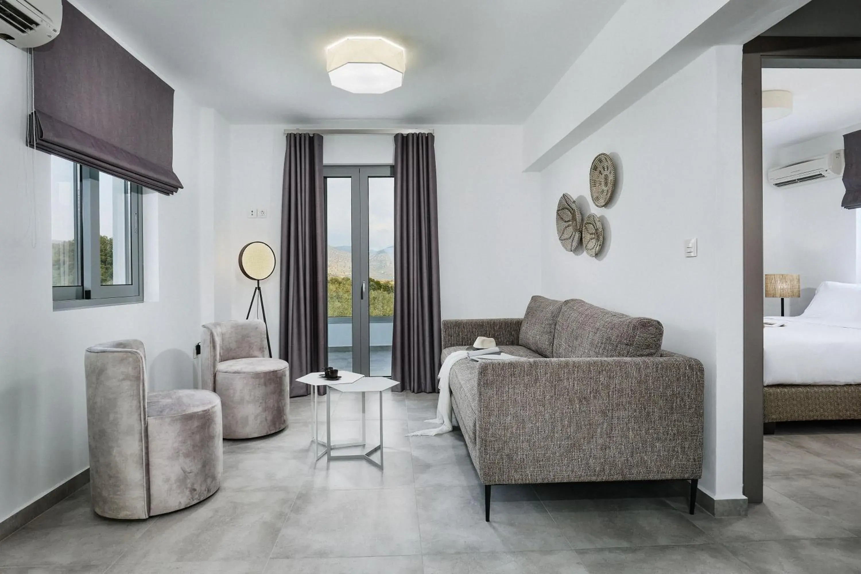 Living room, Bed in Quattro Suites Living room, Bed in Quattro Suites