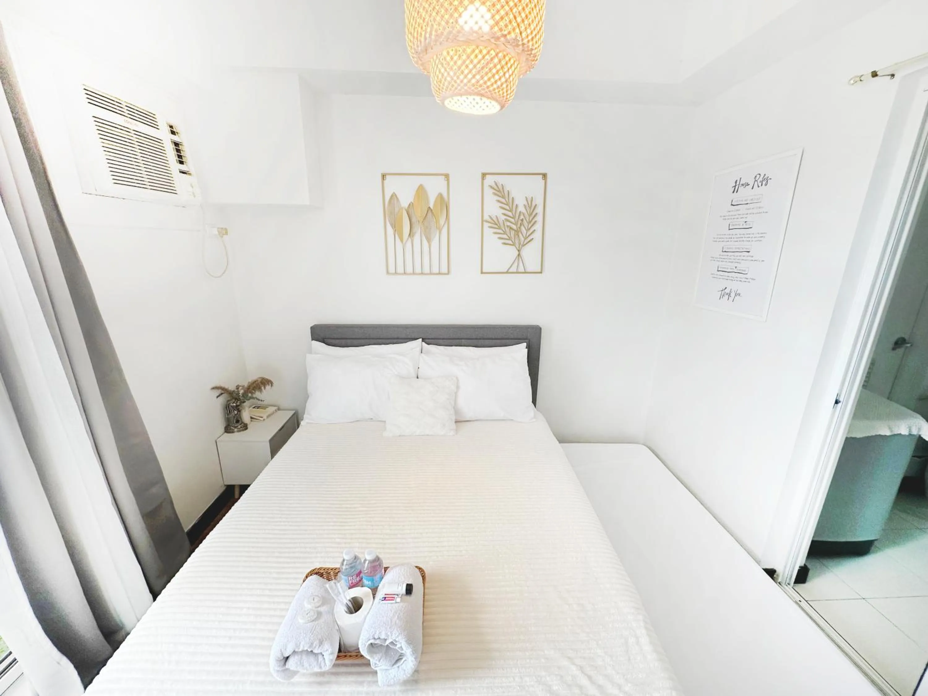 Bed in Zinnia Towers 1BR Condo with PS4 Karaoke Netflix & Swimming Pool