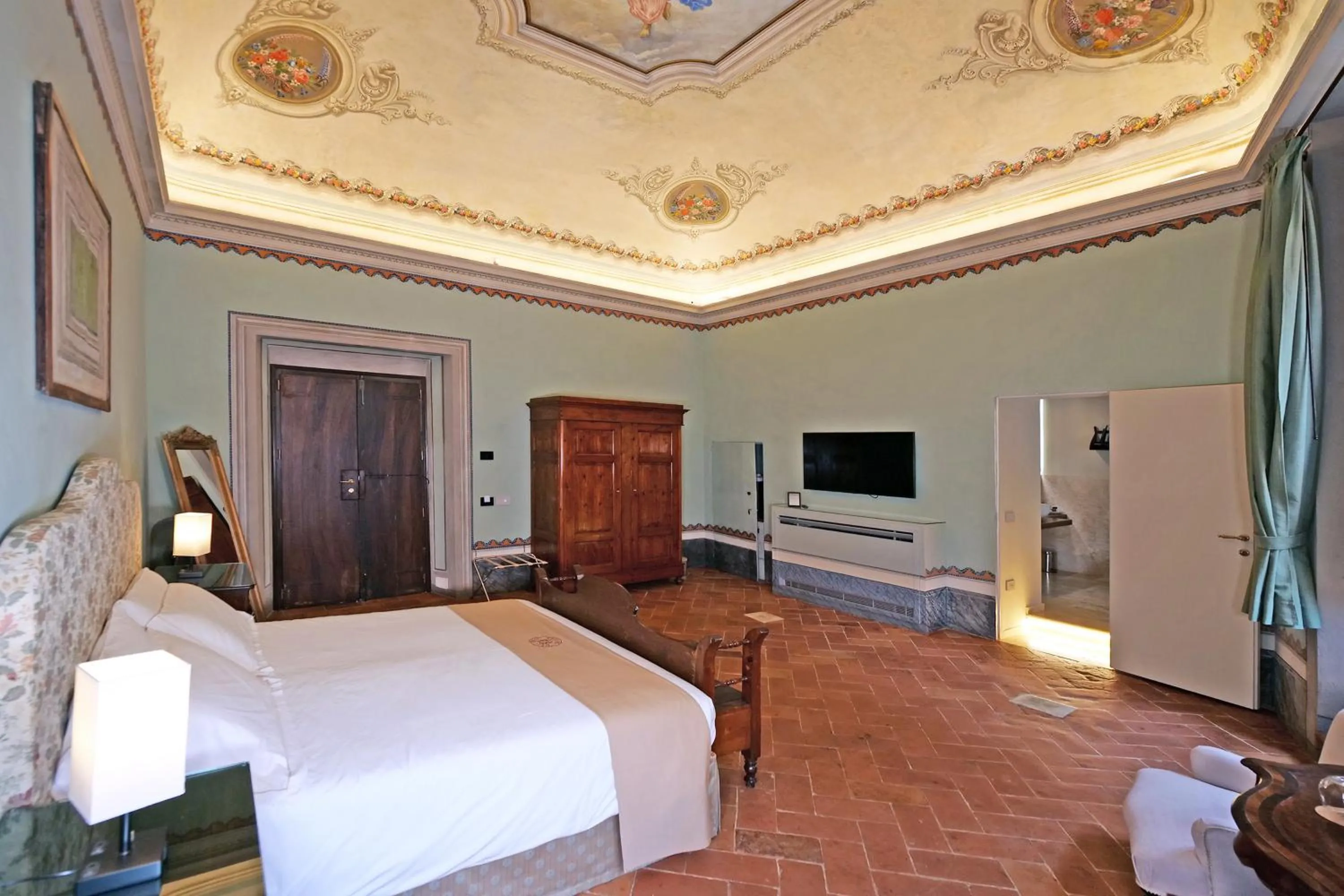 Bed in Delcorto Suites