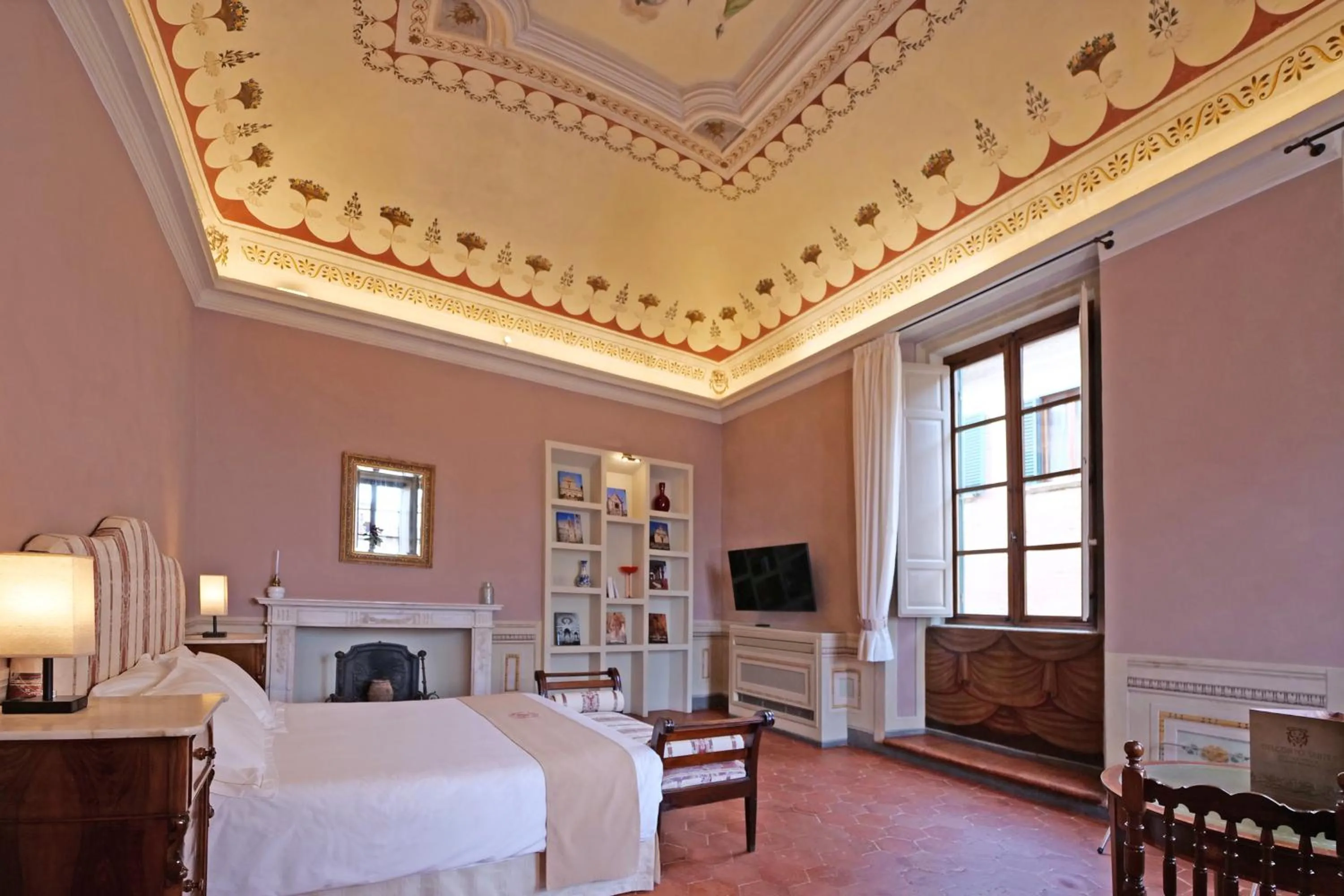 Bed in Delcorto Suites