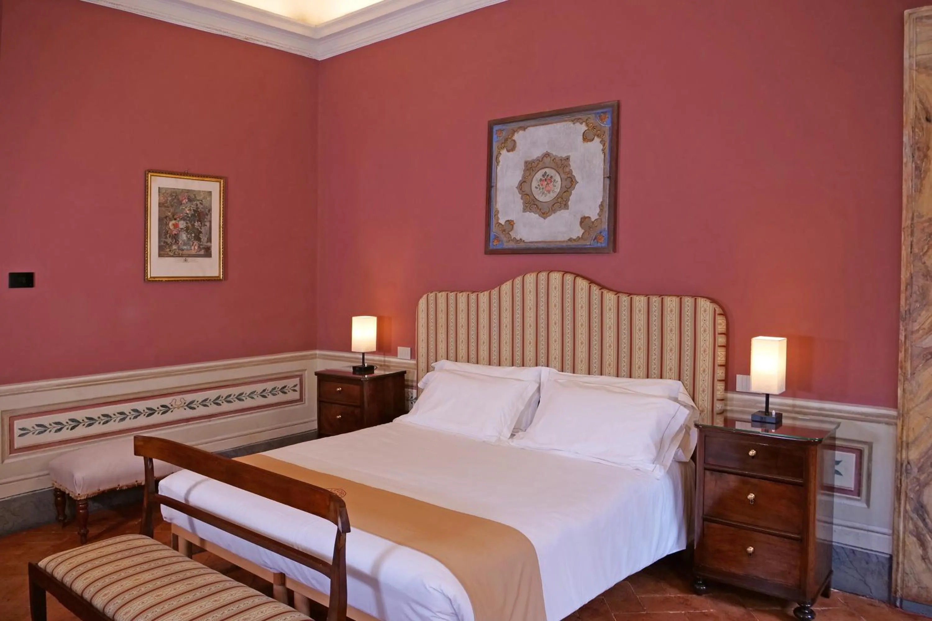 Bed in Delcorto Suites