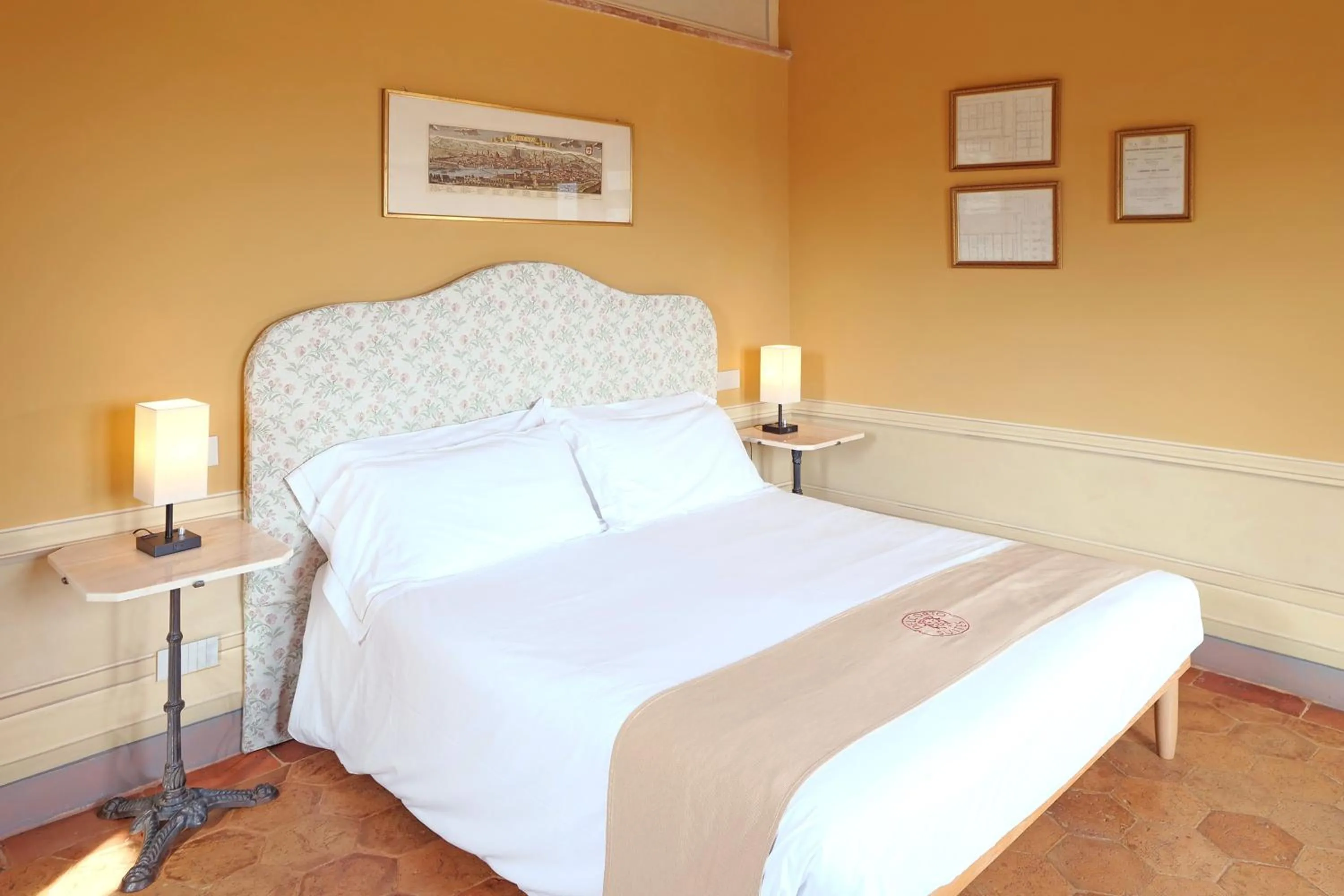 Bed in Delcorto Suites