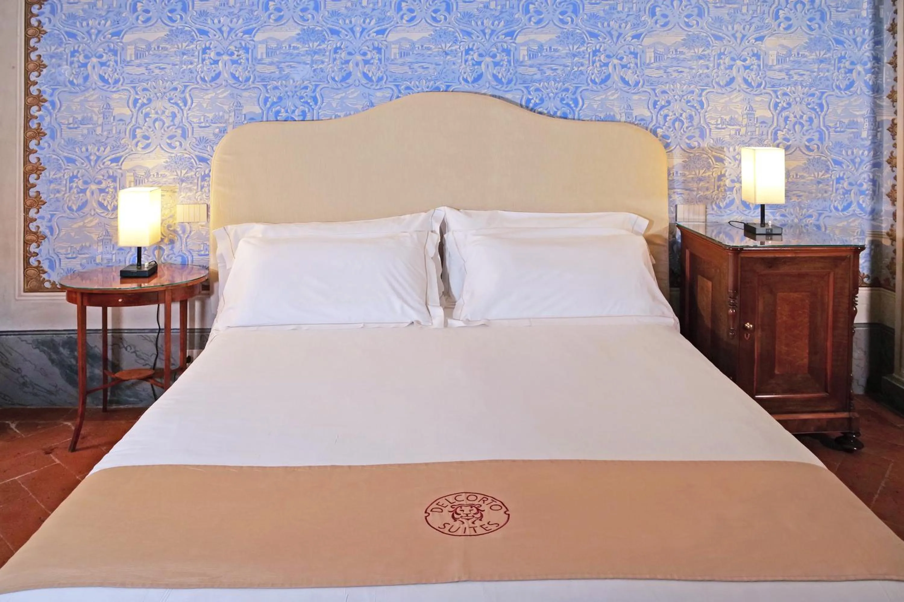 Bed in Delcorto Suites