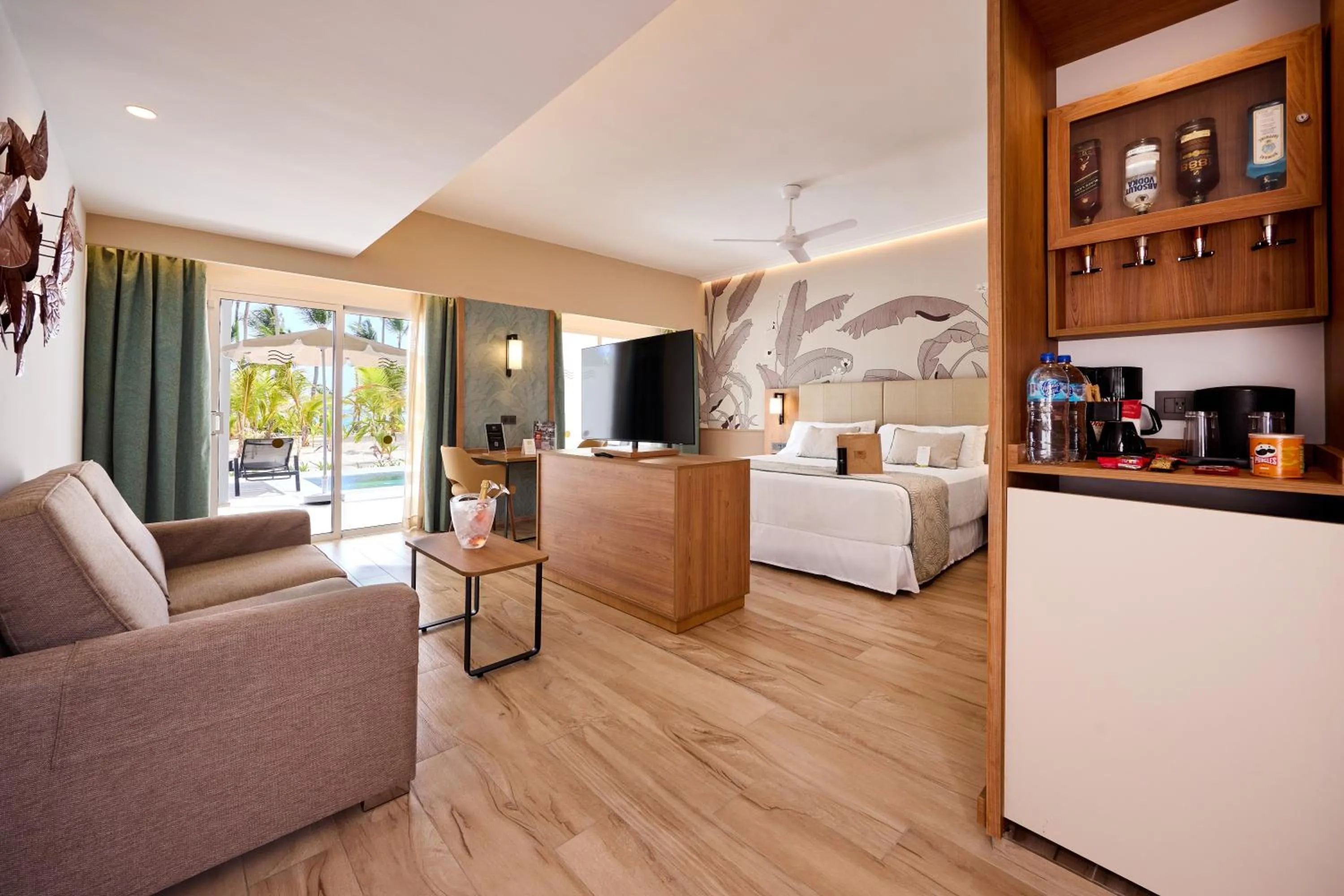 Living room, Bed in Riu Palace Bavaro - All Inclusive