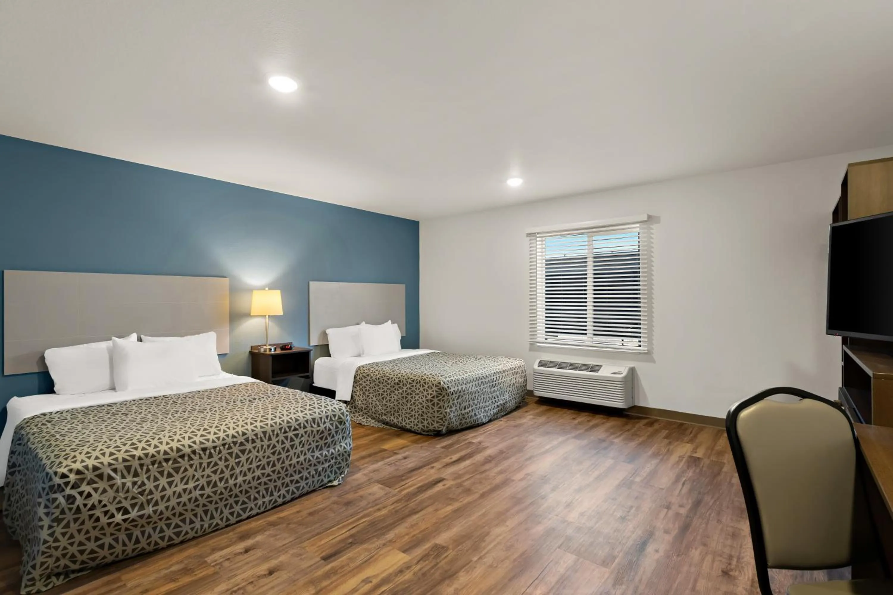 Bedroom in WoodSpring Suites Fort Collins