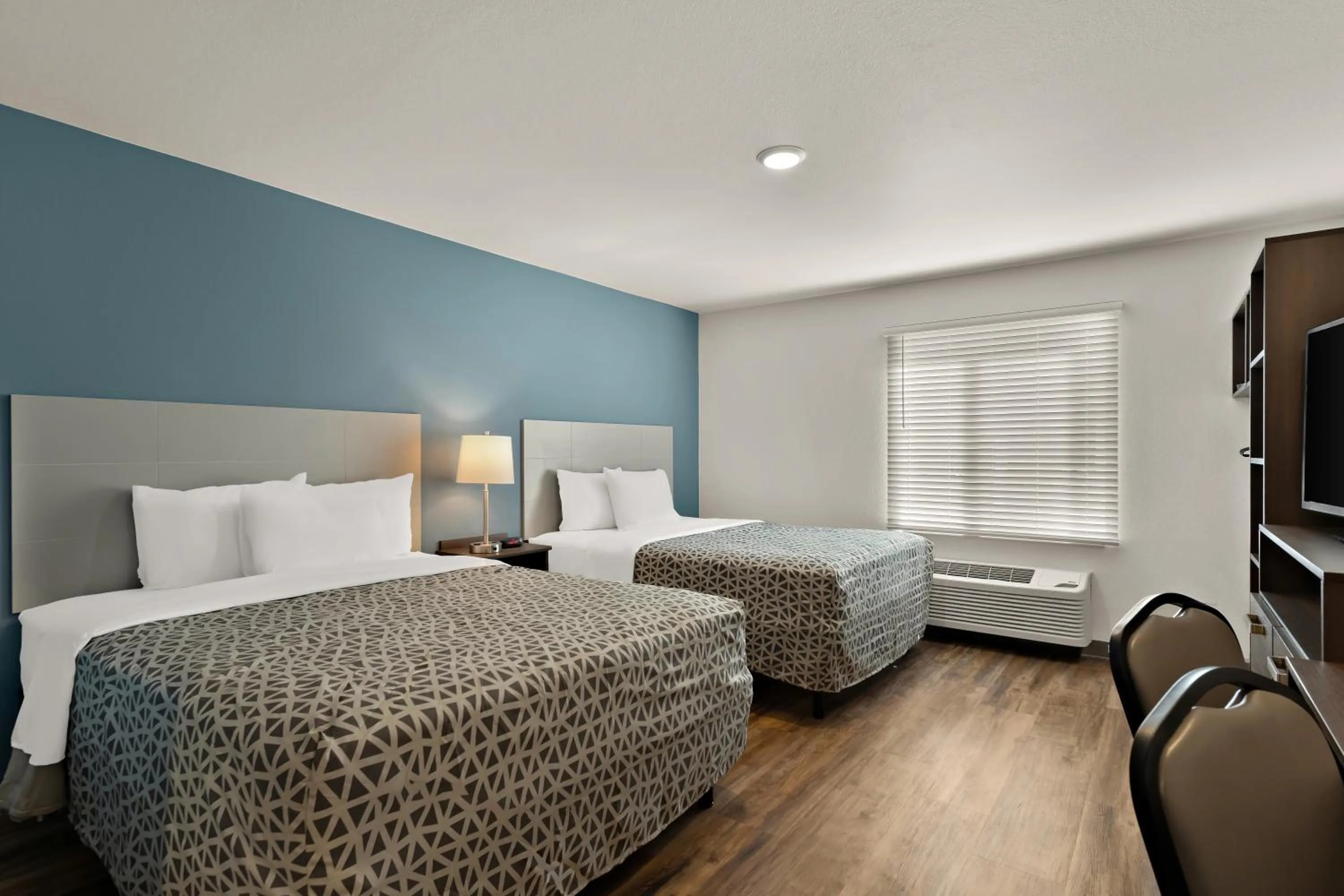 Bedroom in WoodSpring Suites Fort Collins