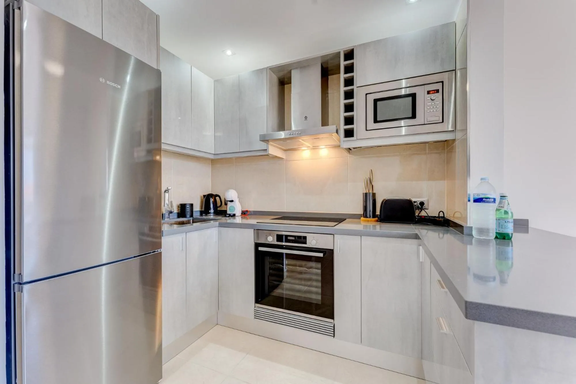 Kitchen or kitchenette in Sea & Green Golf View Duplex Heated POOL