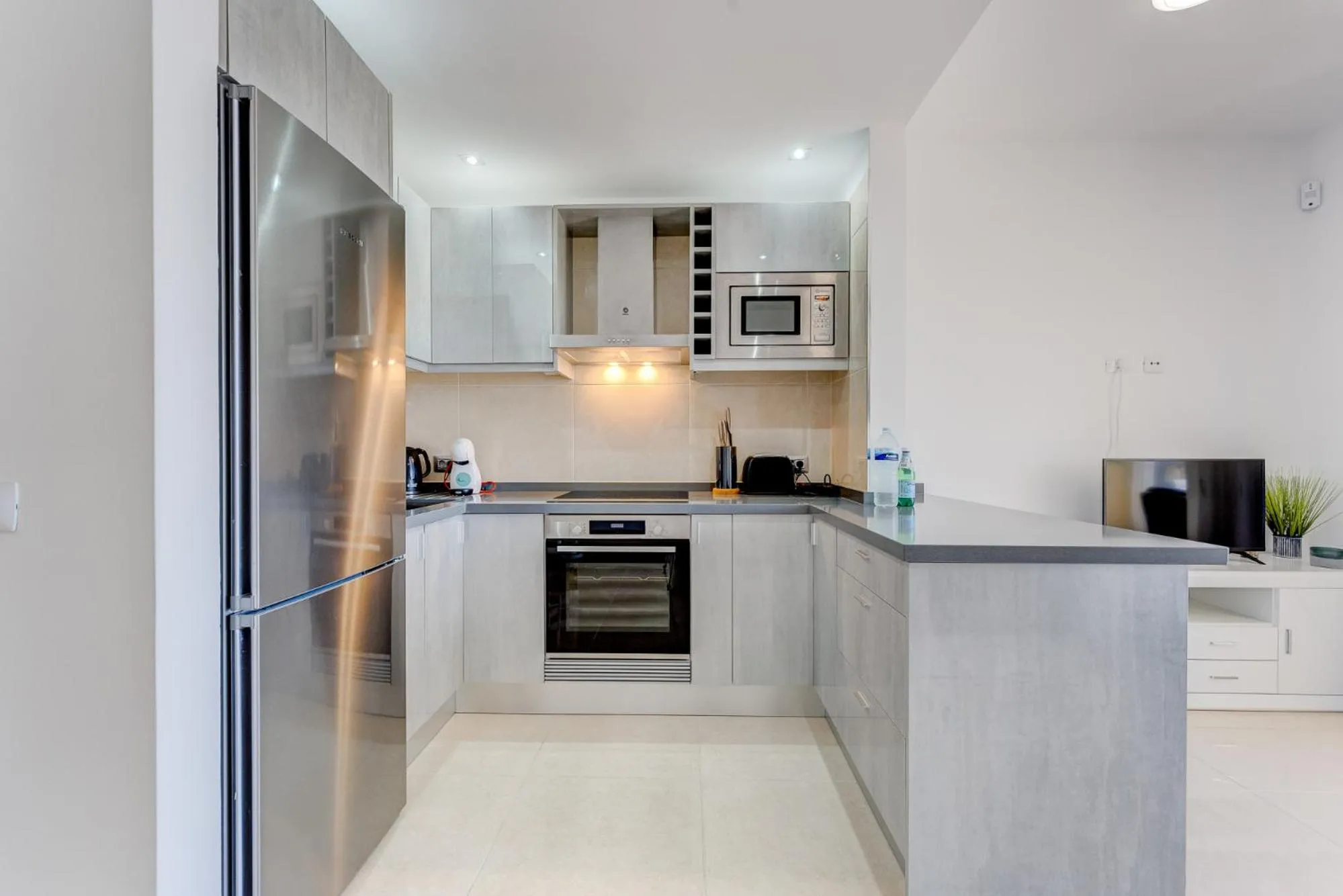 Kitchen or kitchenette in Sea & Green Golf View Duplex Heated POOL