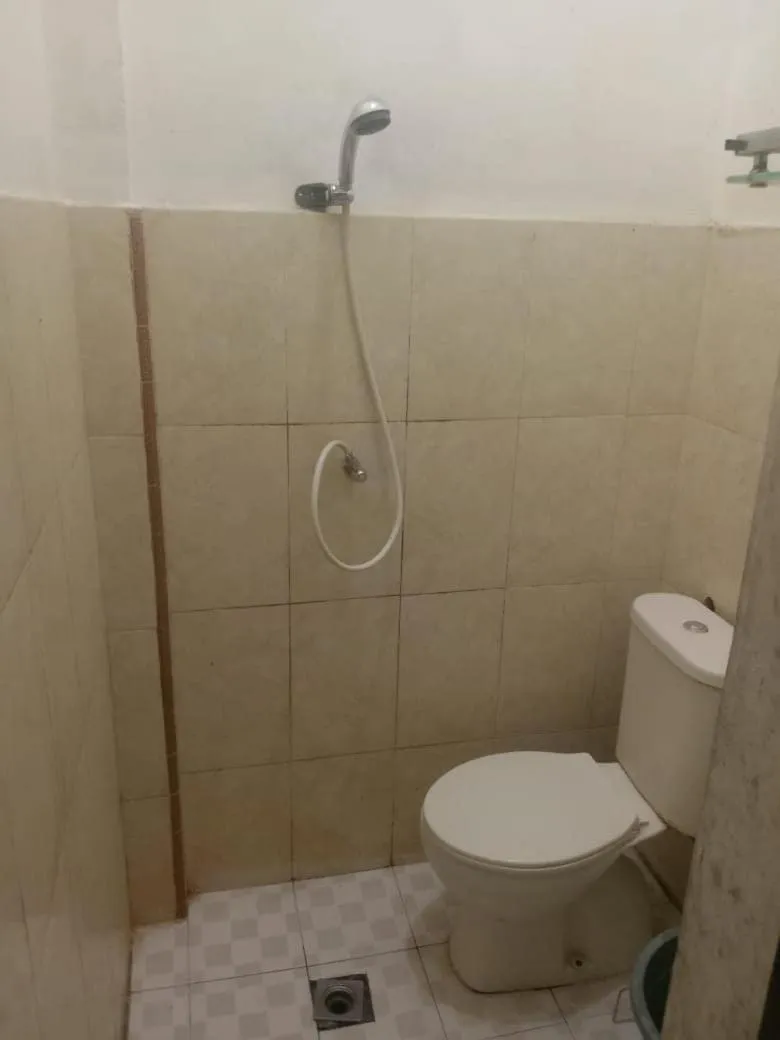 Bathroom in Hotel O Penginapan & Villa Sirait