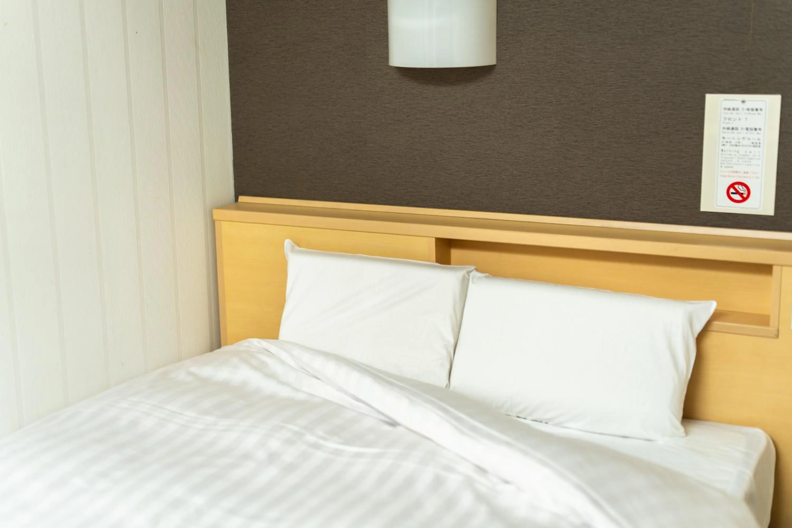 Bed in Ramada Encore by Wyndham Amagasaki