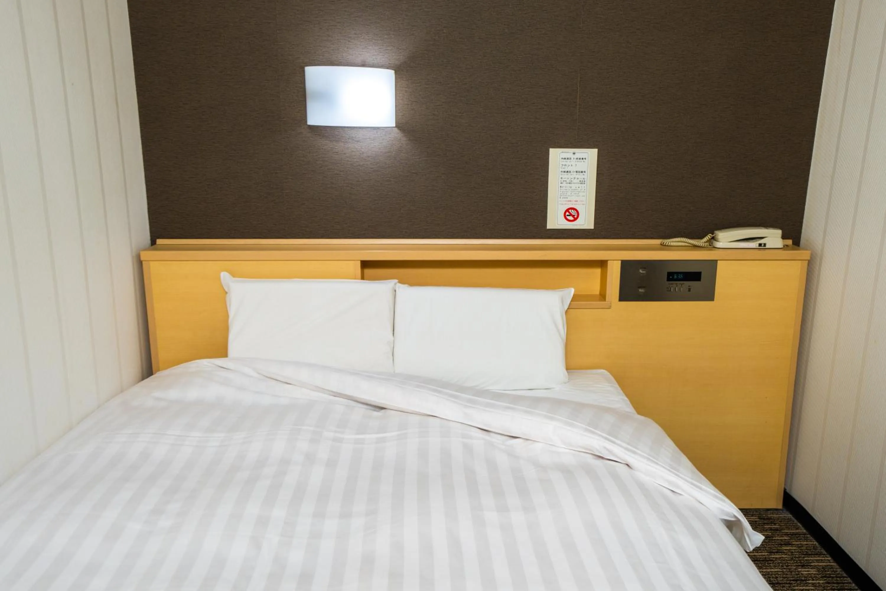 Bed in Ramada Encore by Wyndham Amagasaki