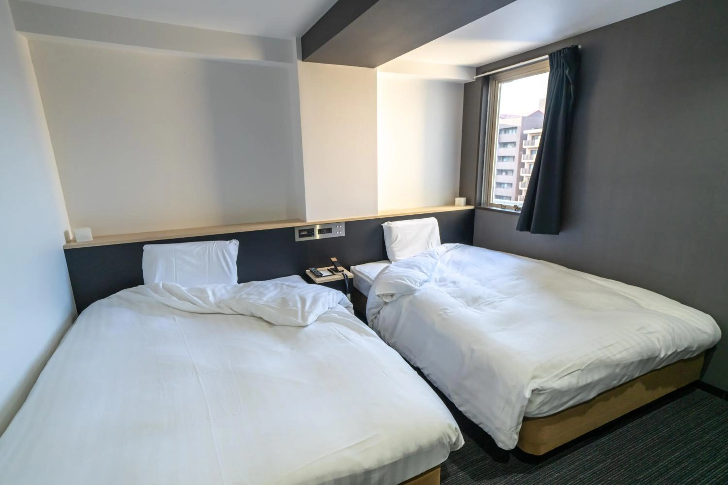 Bed in Ramada Encore by Wyndham Amagasaki