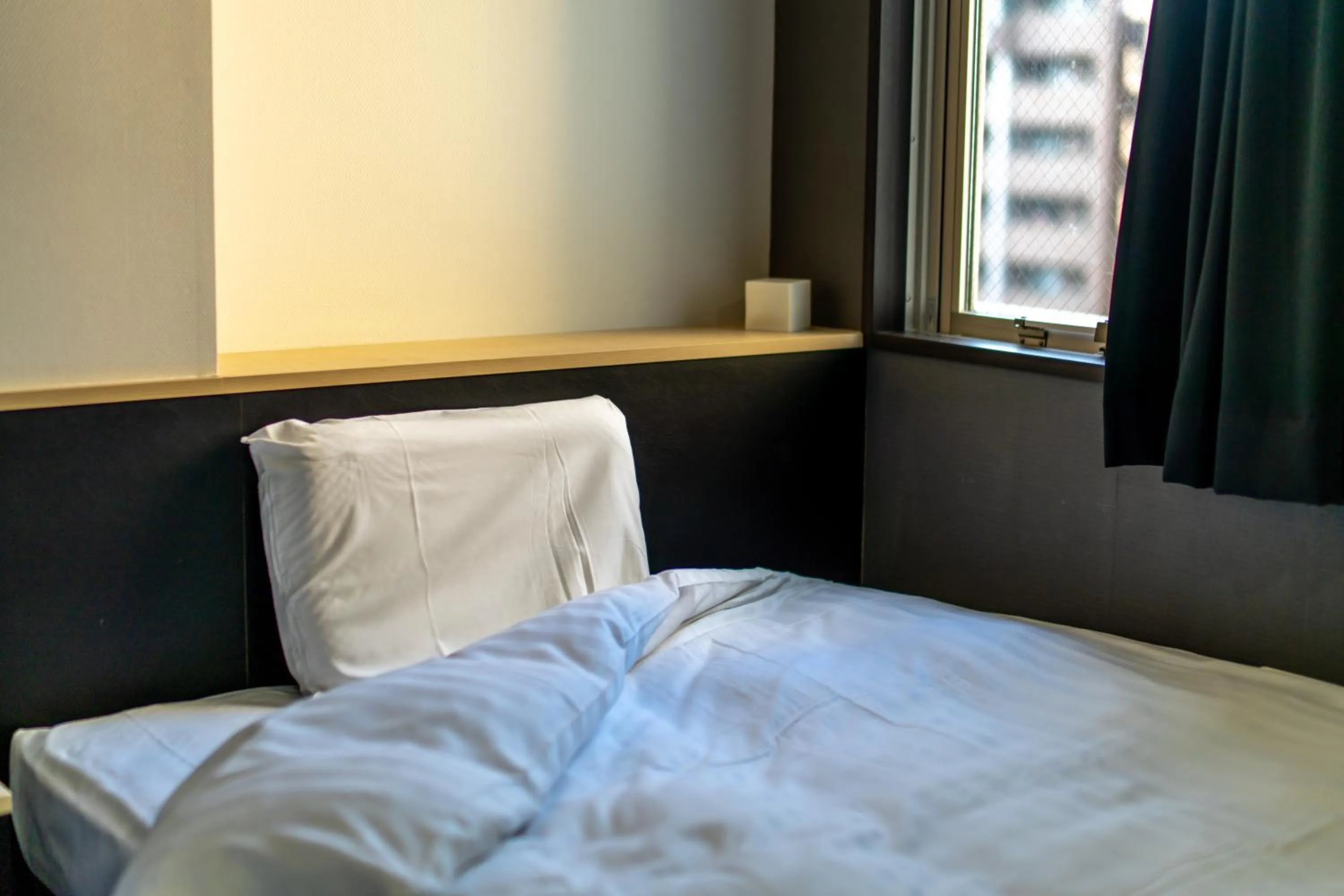 Bed in Ramada Encore by Wyndham Amagasaki