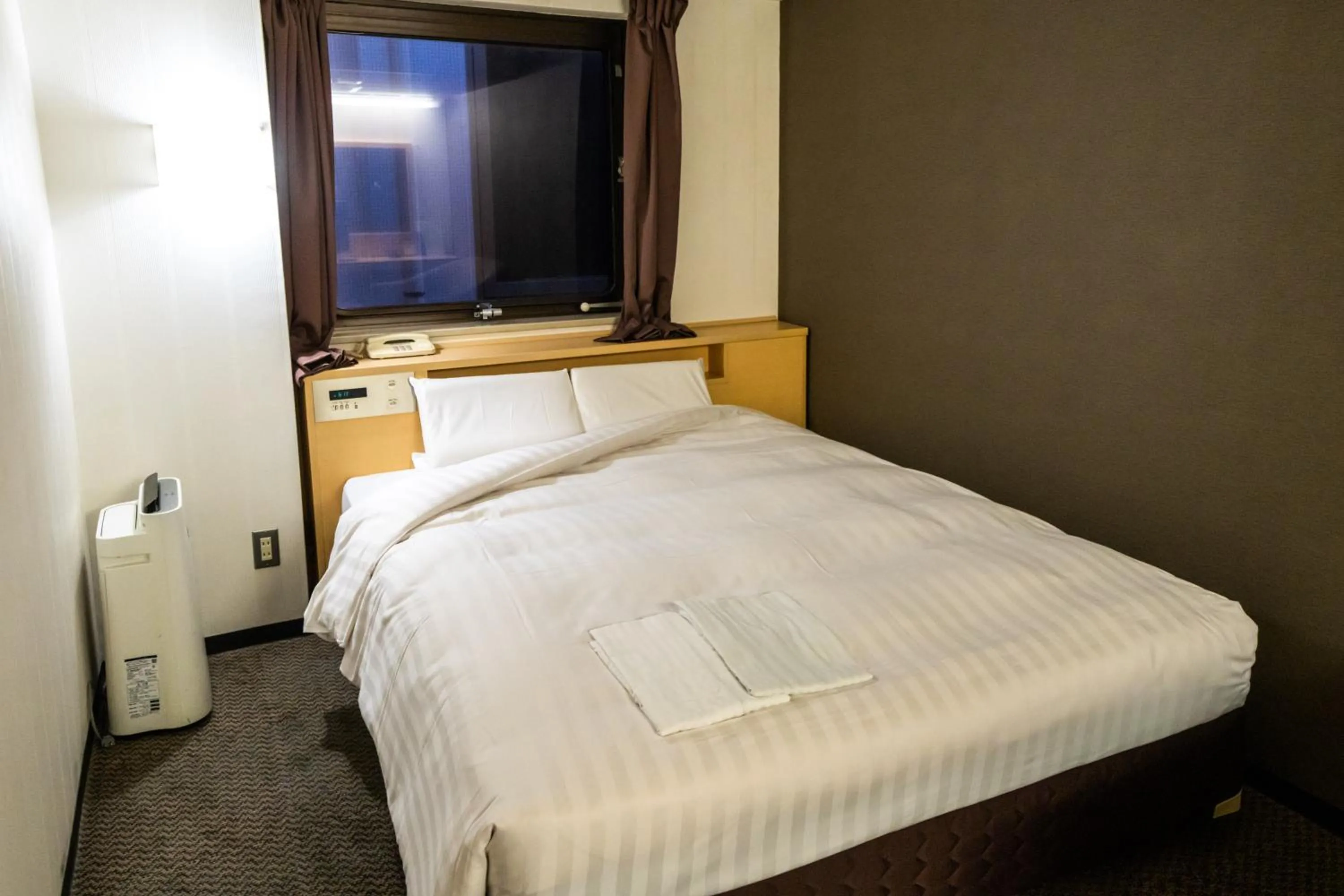 Bed in Ramada Encore by Wyndham Amagasaki