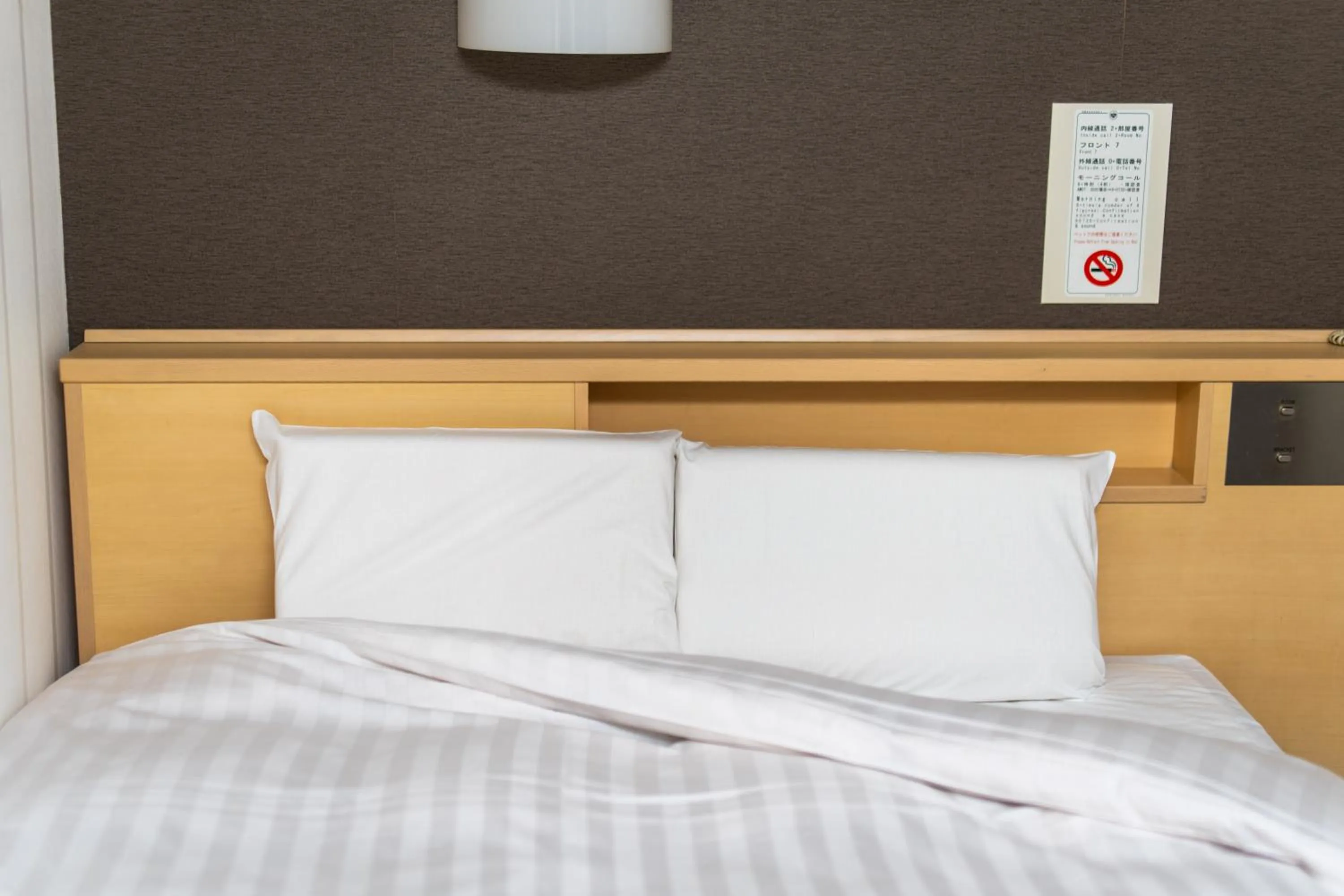 Bed in Ramada Encore by Wyndham Amagasaki