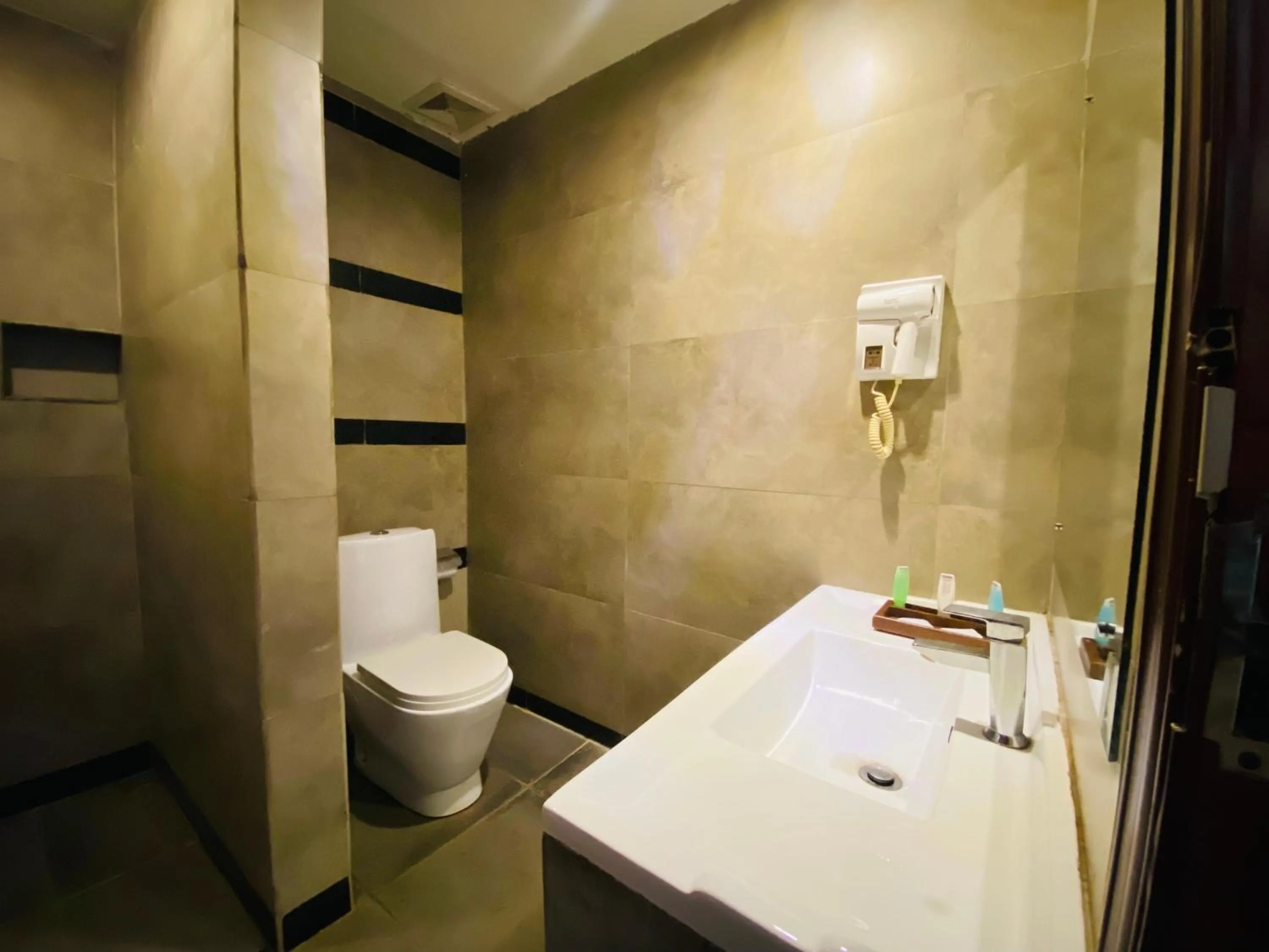 Toilet in Carolina Beach Resort & Spa