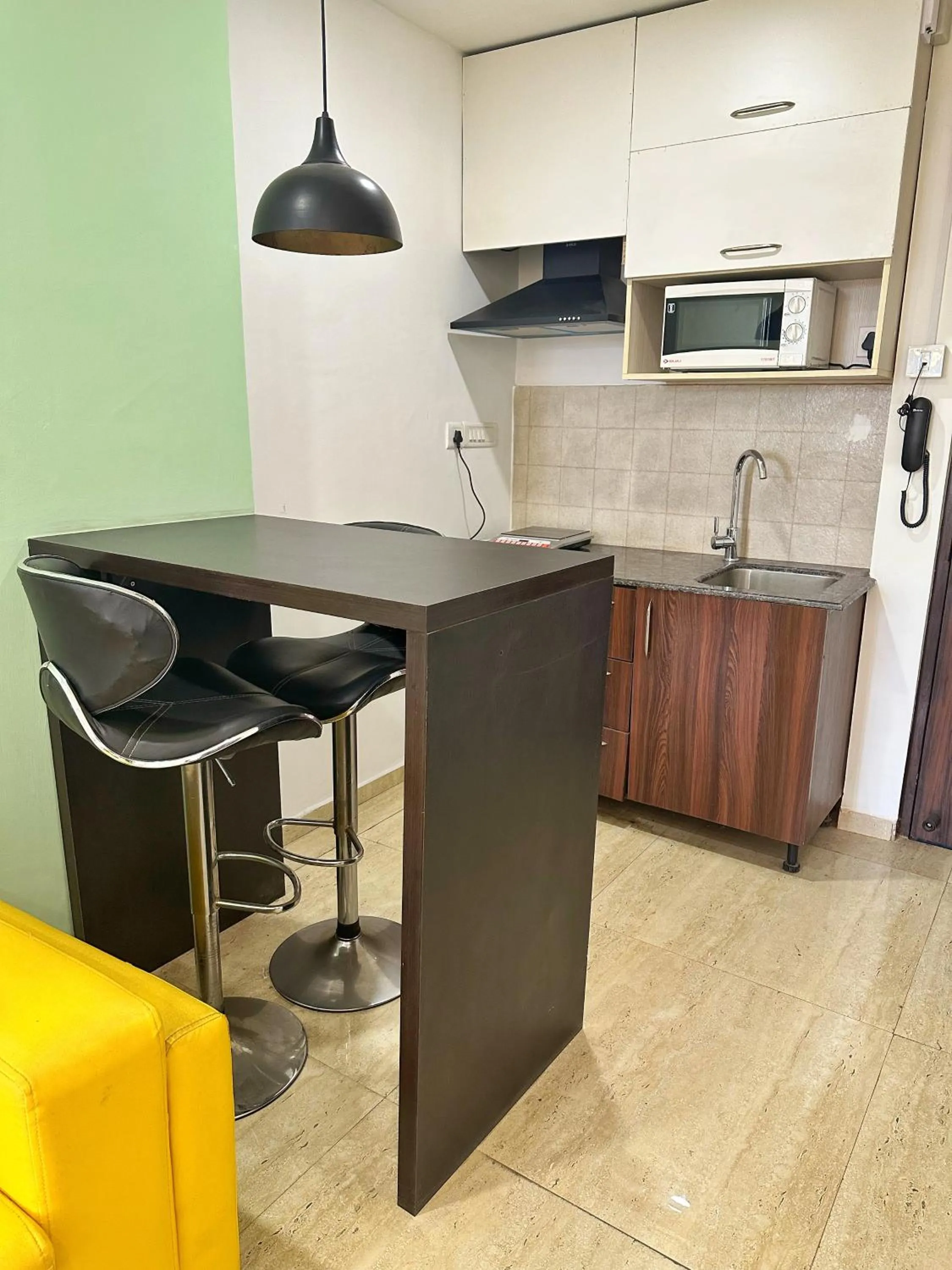 Kitchen or kitchenette in Flamingo Hotel Sector 67 I Studio Rooms I Gurgaon