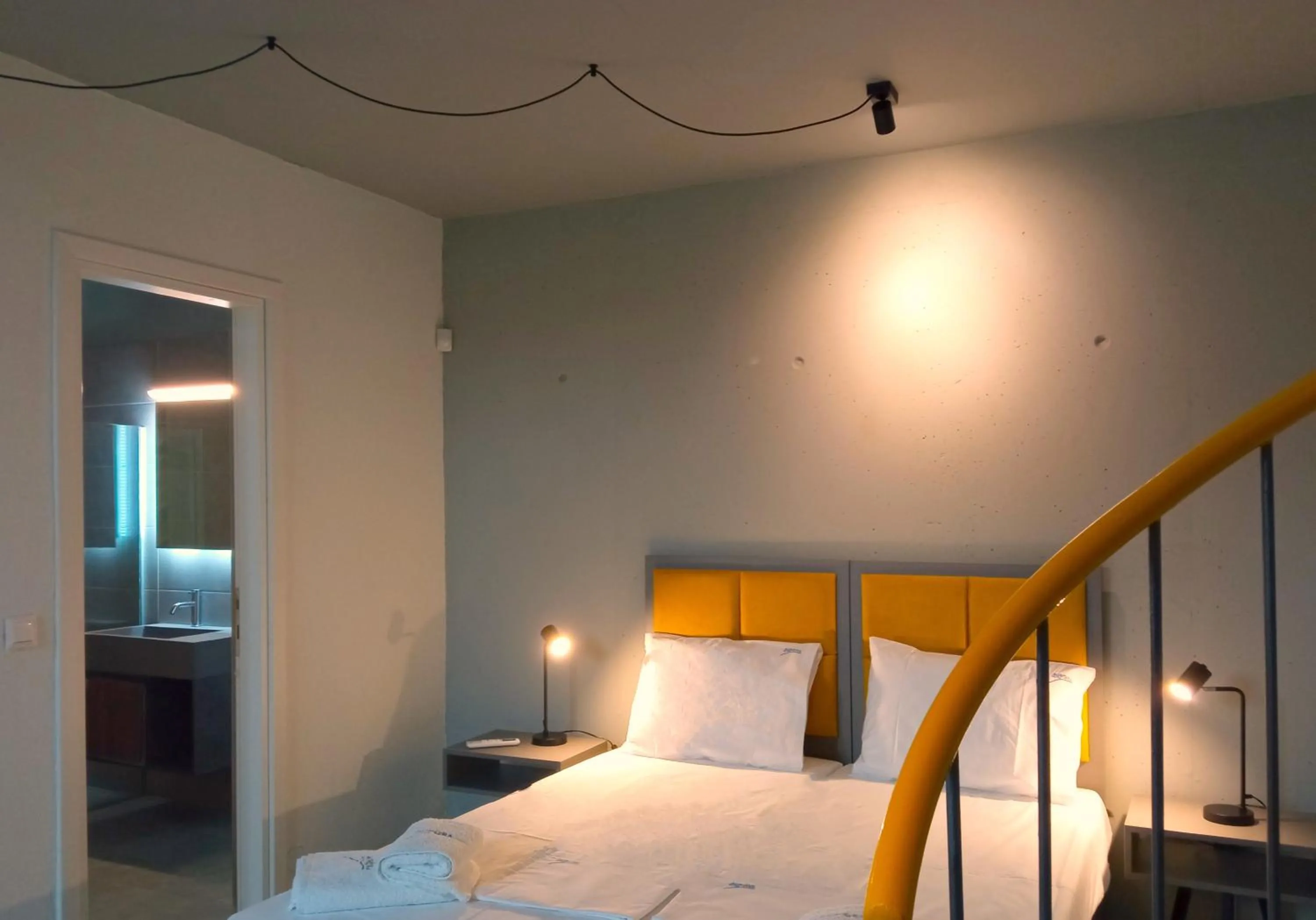 Bedroom, Bed in Aurora Suites