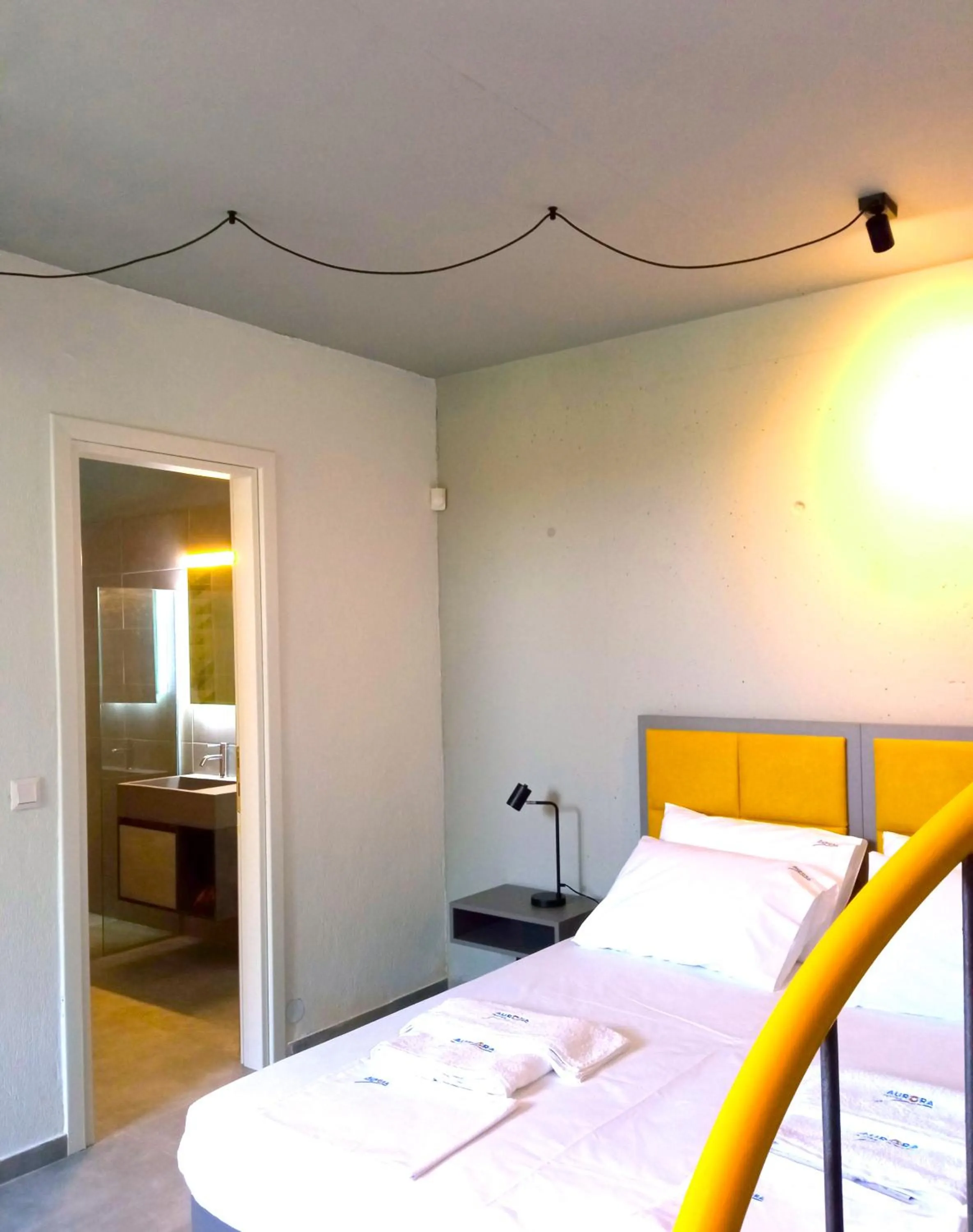 Bathroom, Bed in Aurora Suites